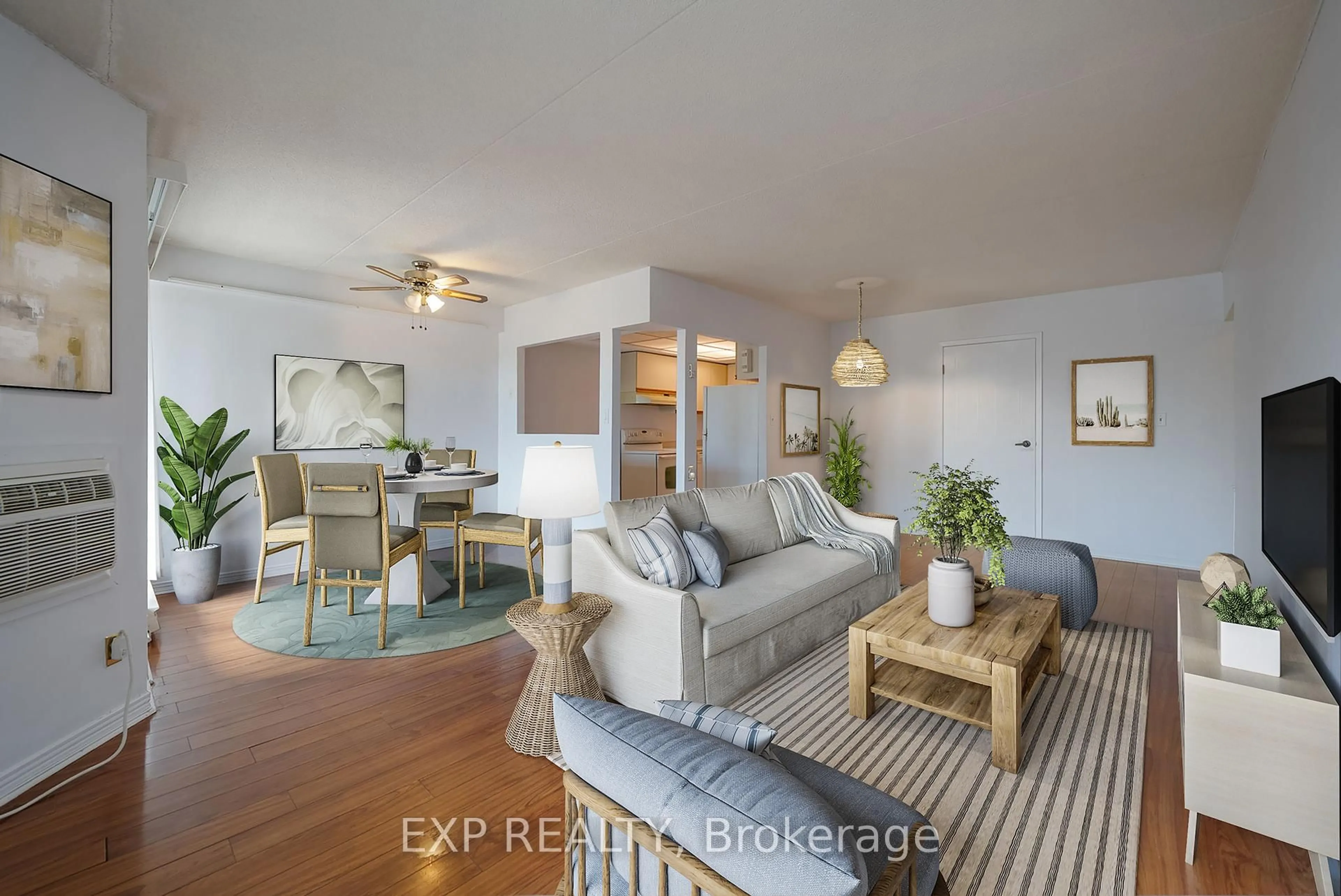 Living room with furniture, wood/laminate floor for 144 Queen St #302, Clarington Ontario L1C 1M9