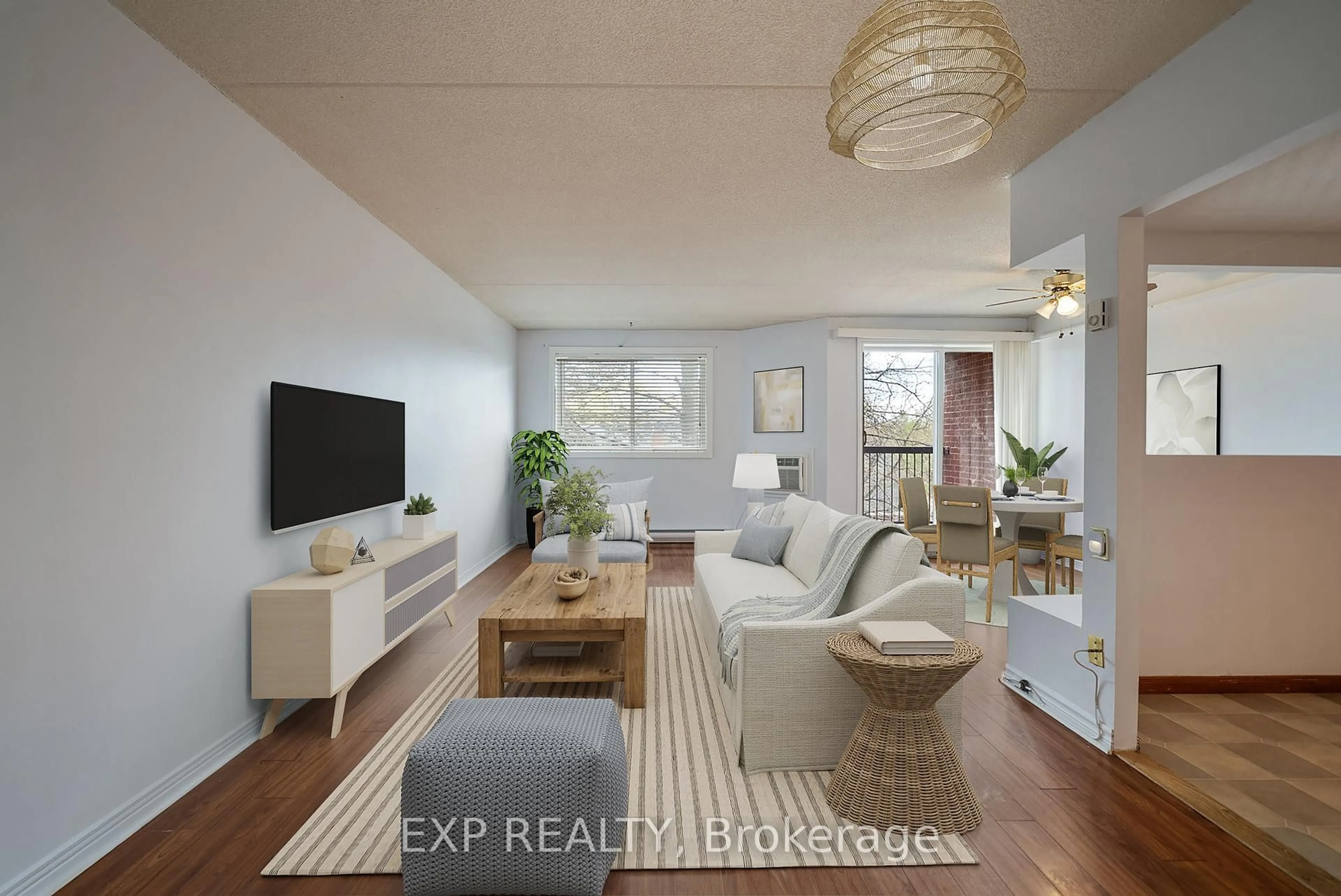 Living room with furniture, wood/laminate floor for 144 Queen St #302, Clarington Ontario L1C 1M9