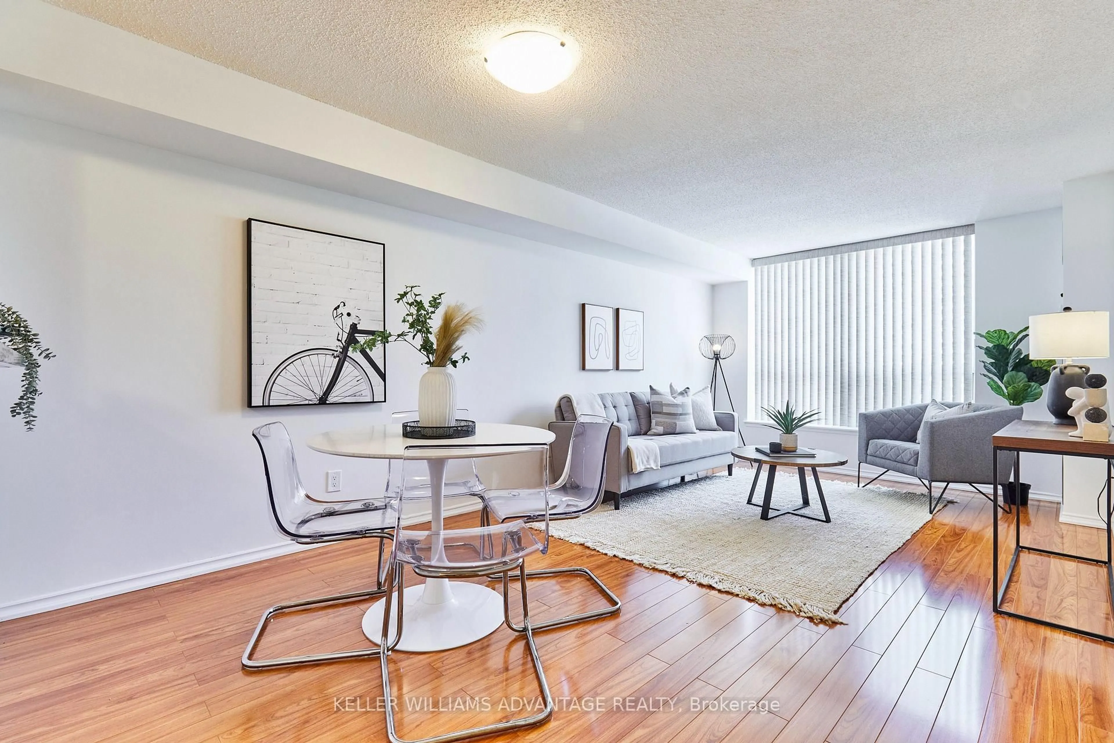 Living room with furniture, wood/laminate floor for 410 Mclevin Ave #407, Toronto Ontario M1B 5J5