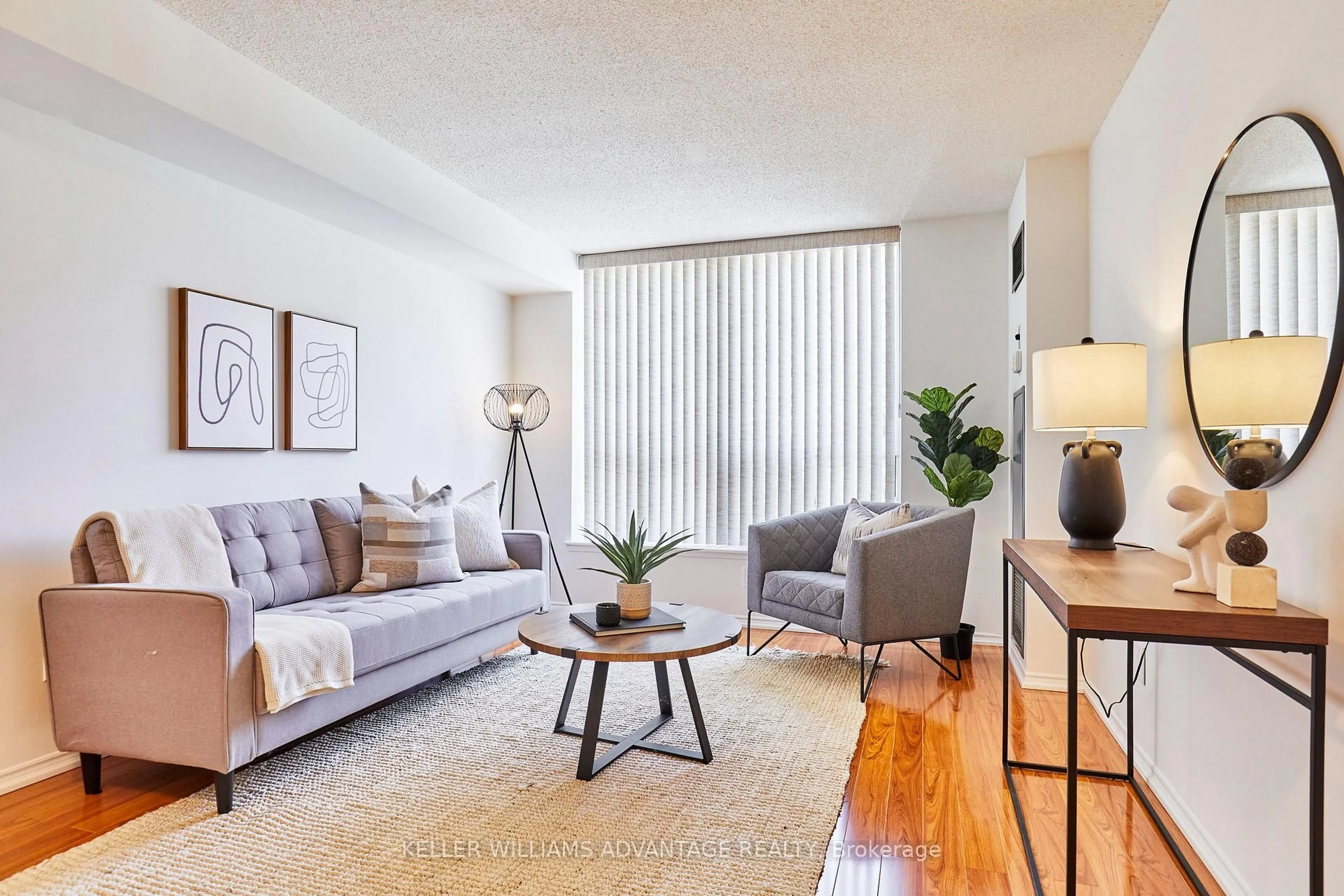 Living room with furniture, wood/laminate floor for 410 Mclevin Ave #407, Toronto Ontario M1B 5J5