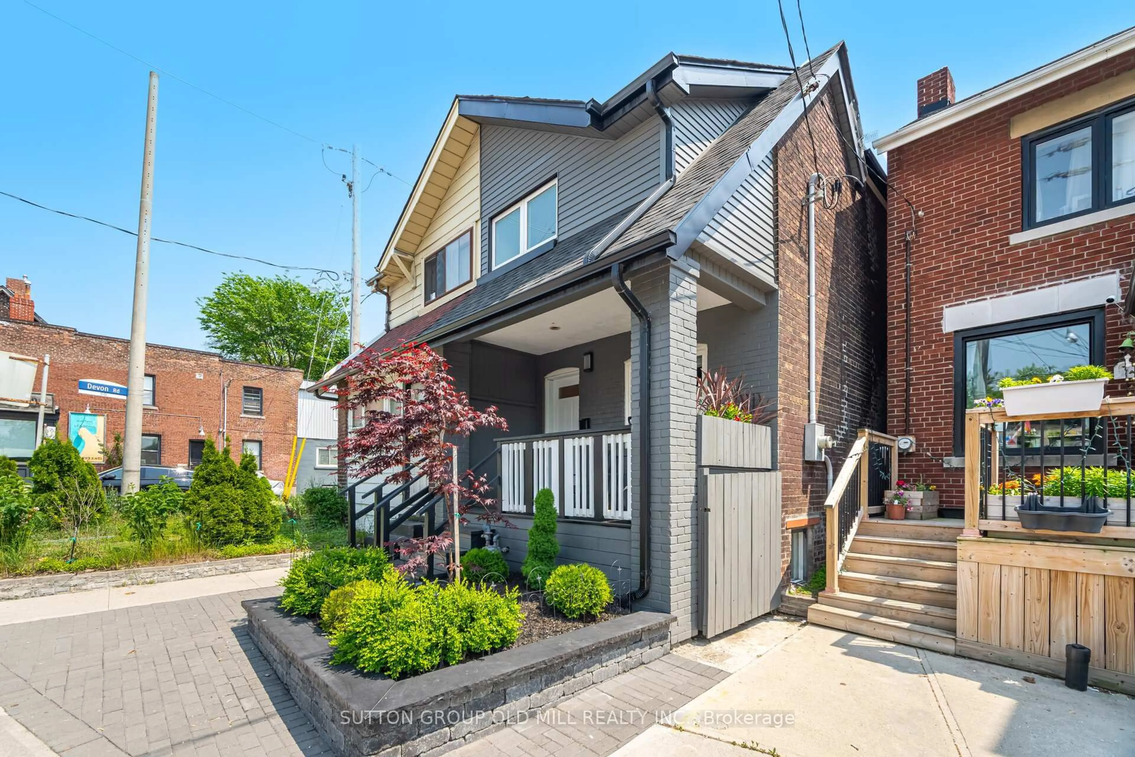 Home with brick exterior material, street for 1995 Gerrard St, Toronto Ontario M4E 2A9