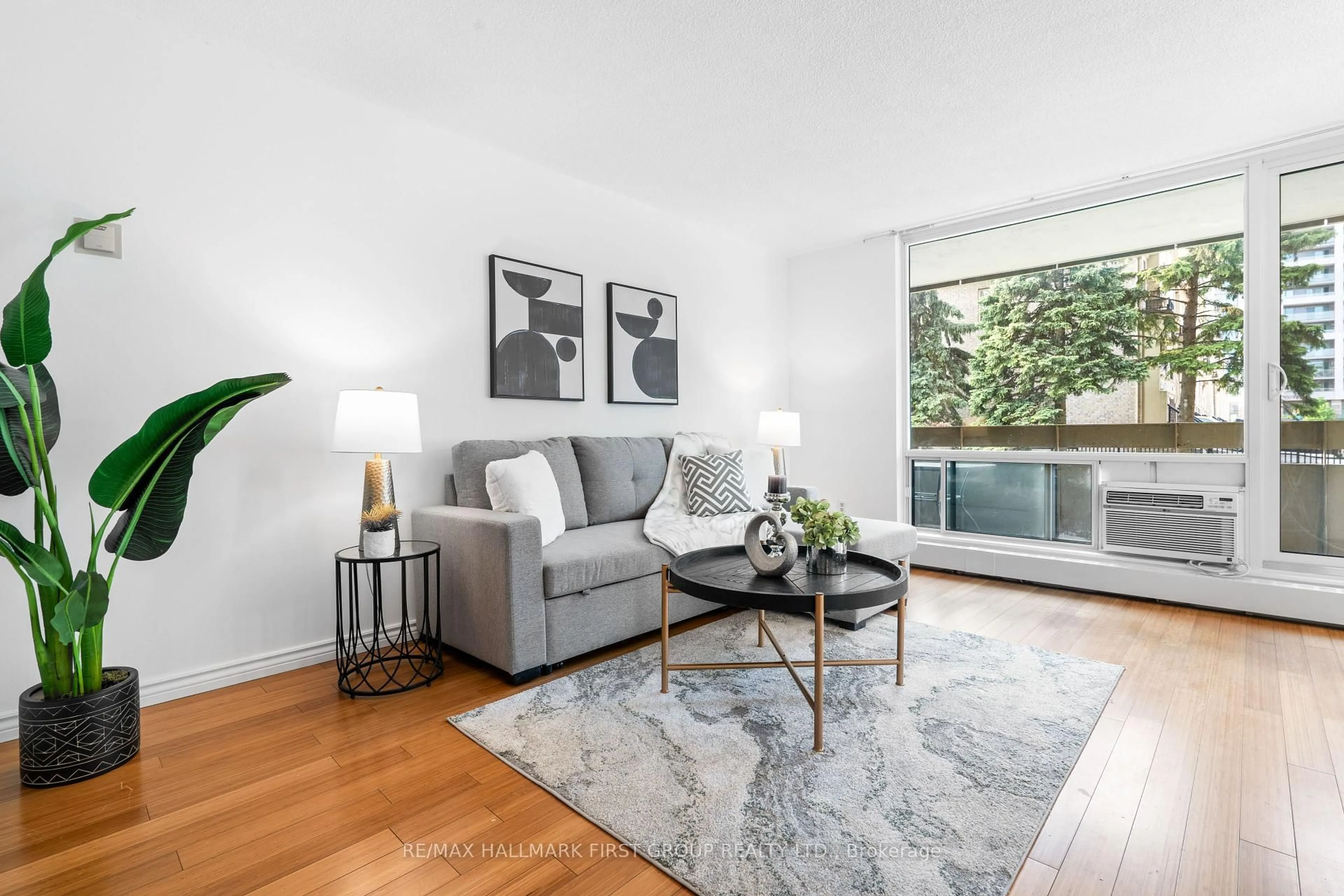 Living room with furniture, wood/laminate floor for 1210 Radom St #209, Pickering Ontario L1W 2Z3