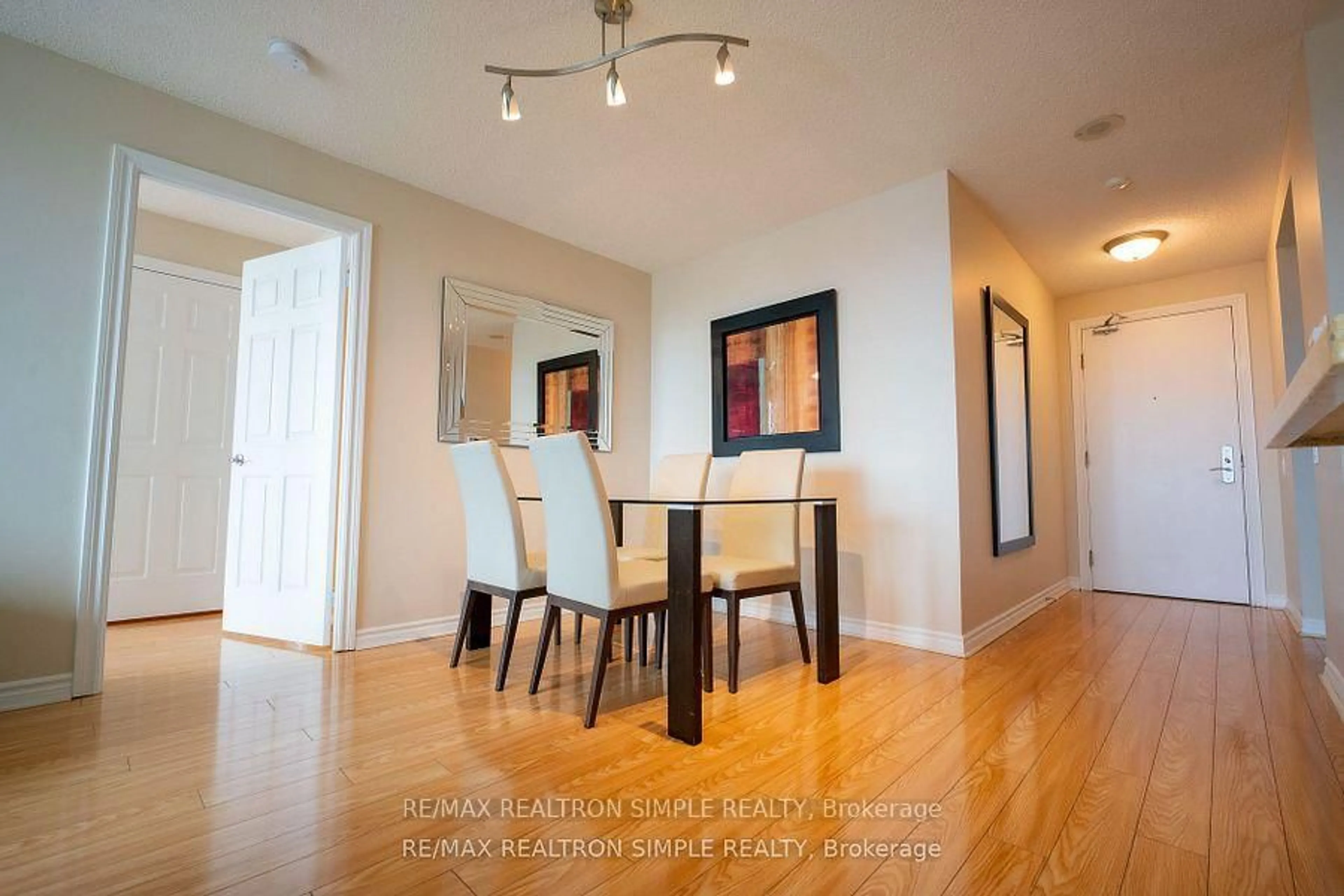 Dining room, wood/laminate floor for 61 Town Centre Crt #1312, Toronto Ontario M1P 5C5