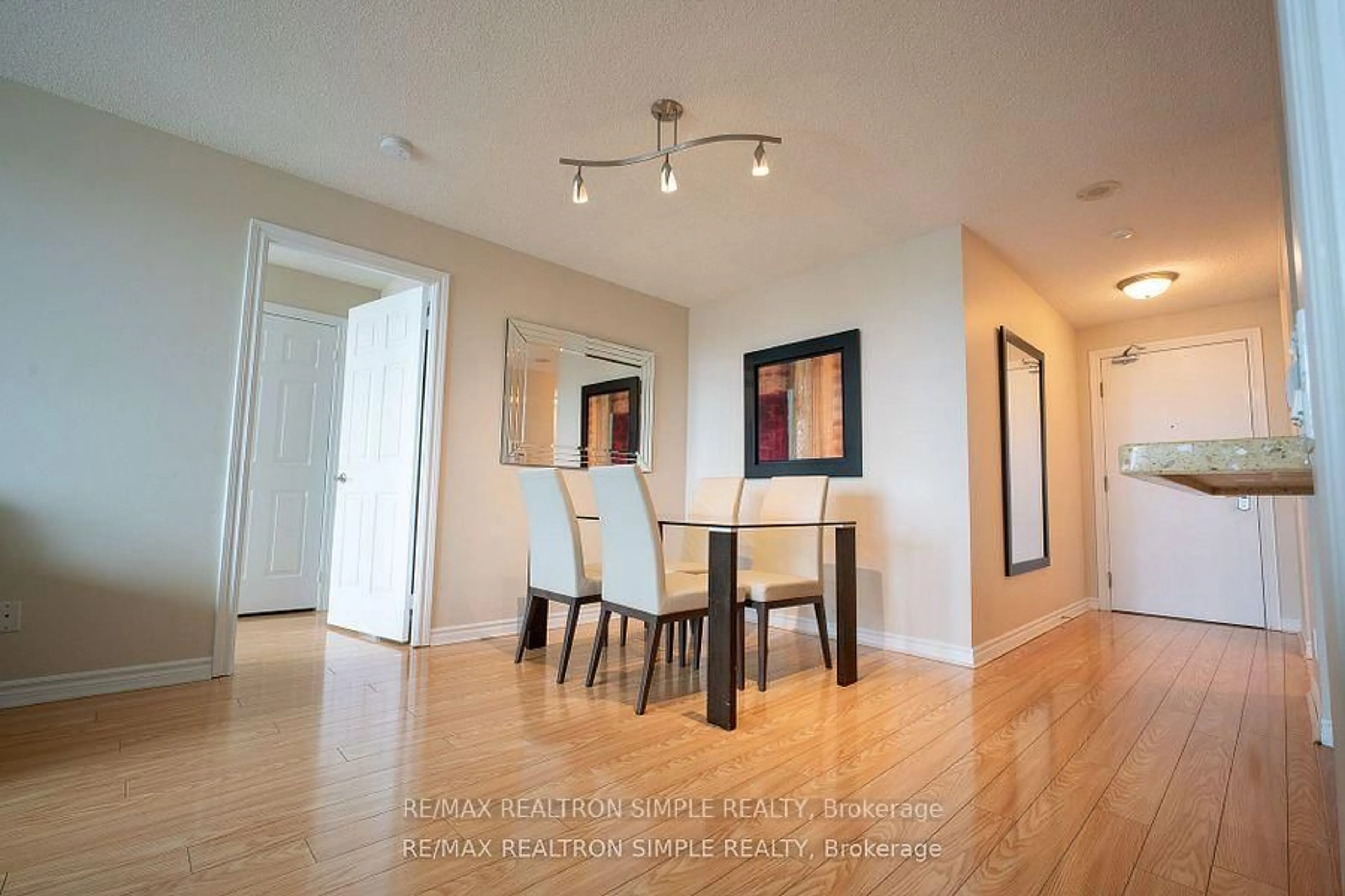 Dining room, wood/laminate floor for 61 Town Centre Crt #1312, Toronto Ontario M1P 5C5