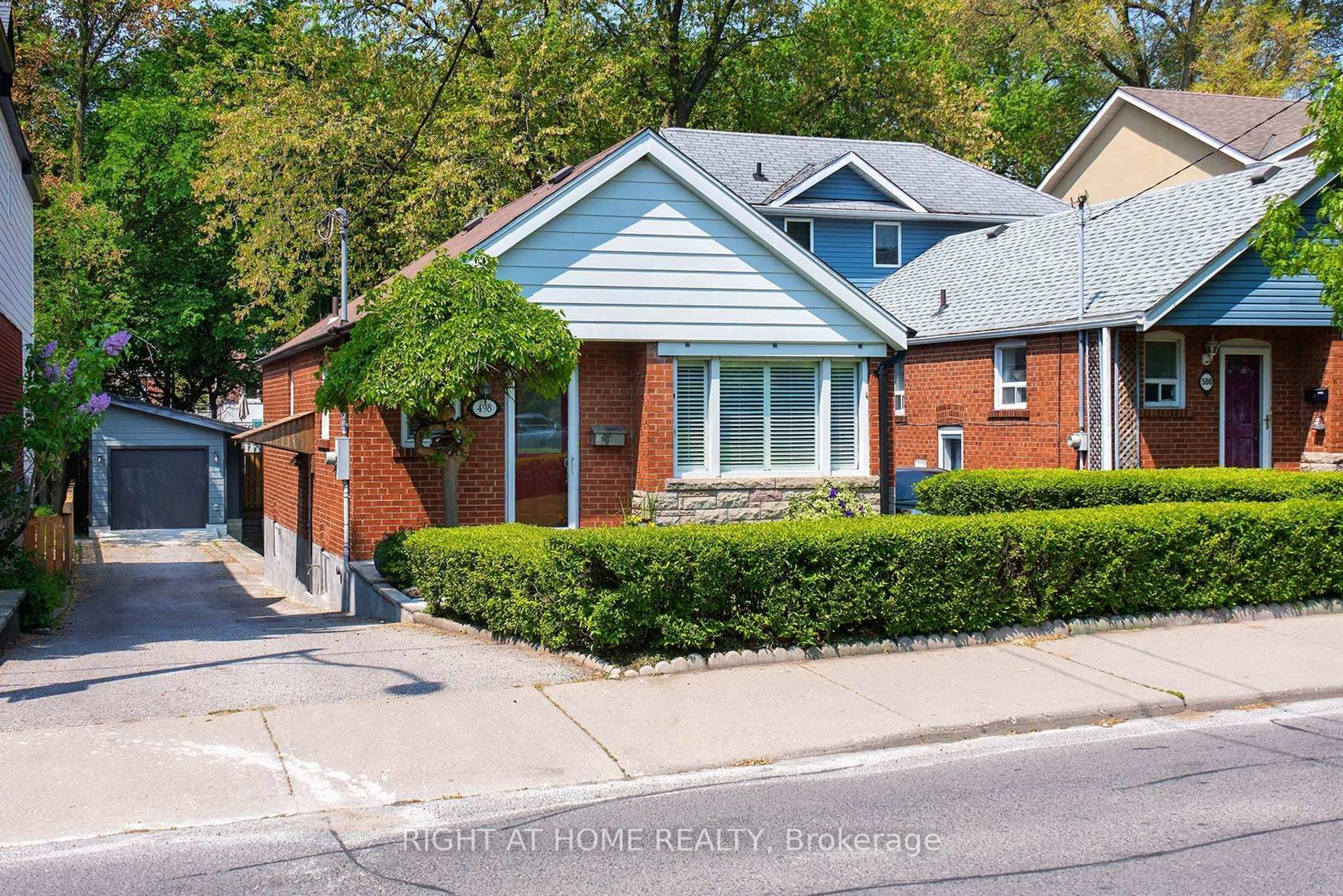 Home with brick exterior material, street for 498 Scarborough Rd, Toronto Ontario M4E 3N2