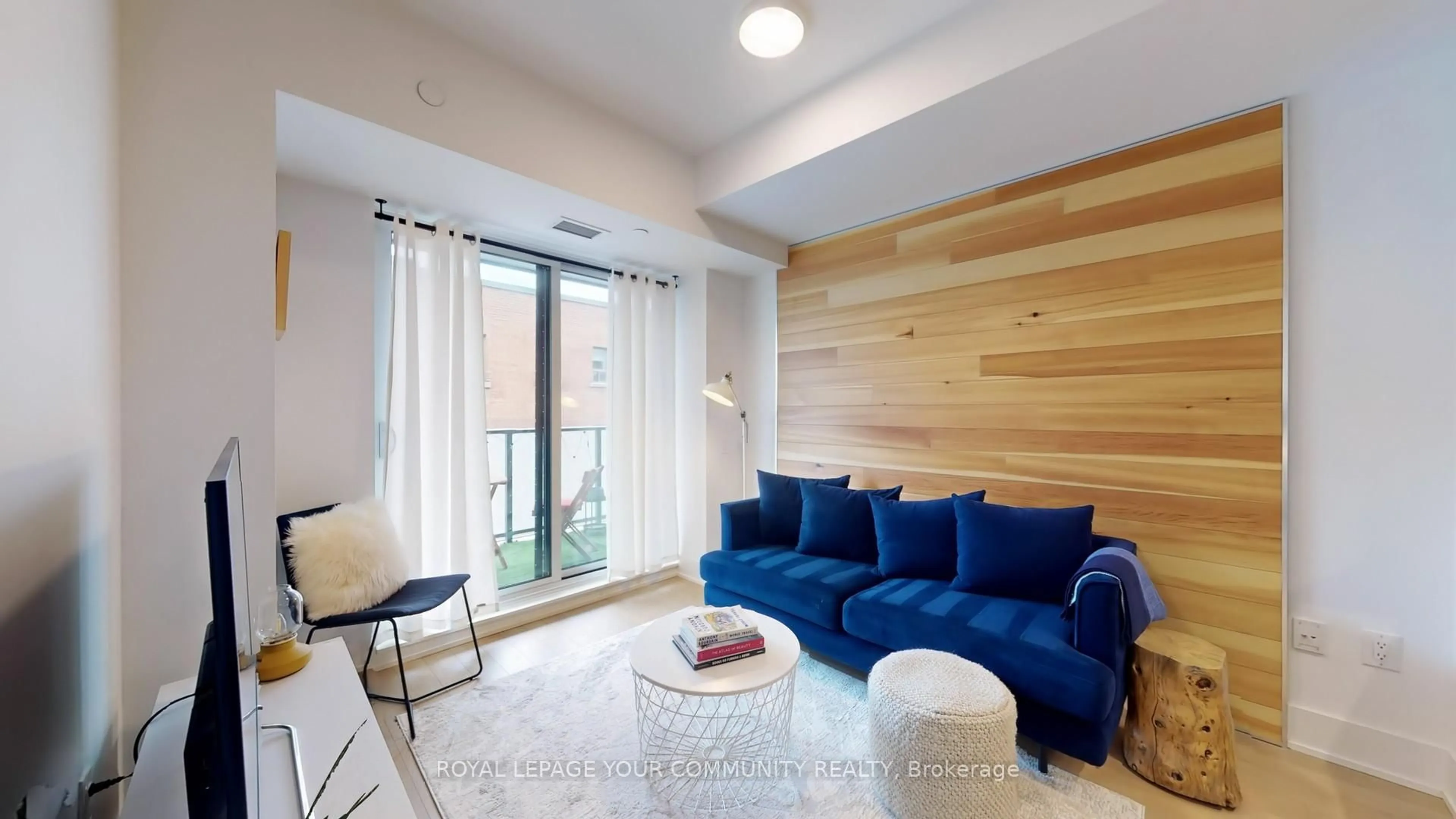 Living room with furniture, wood/laminate floor for 1888 Queen St #307, Toronto Ontario M4L 1H3