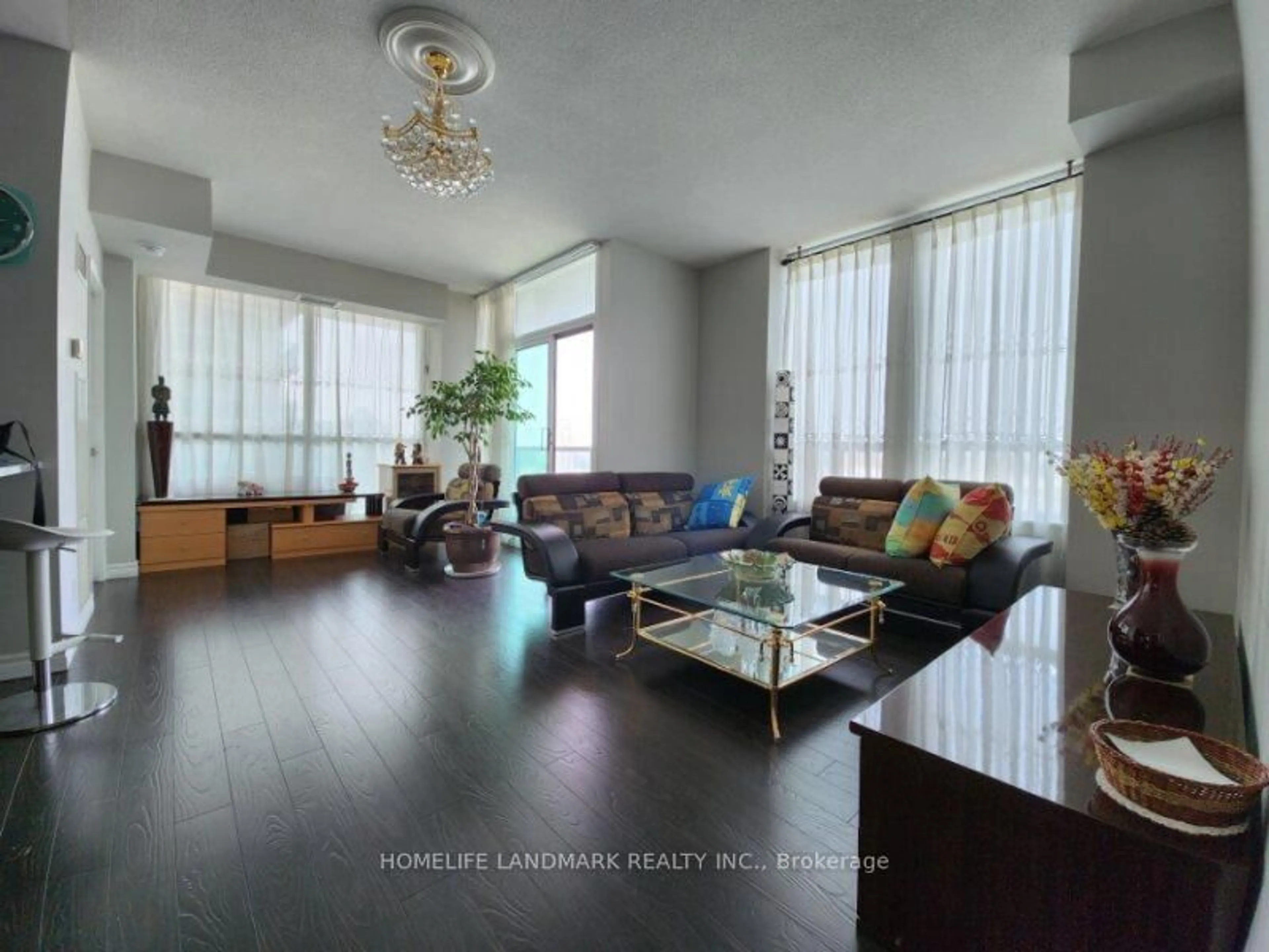Living room with furniture, wood/laminate floor for 68 Grangeway Ave #2105, Toronto Ontario M1H 0A1