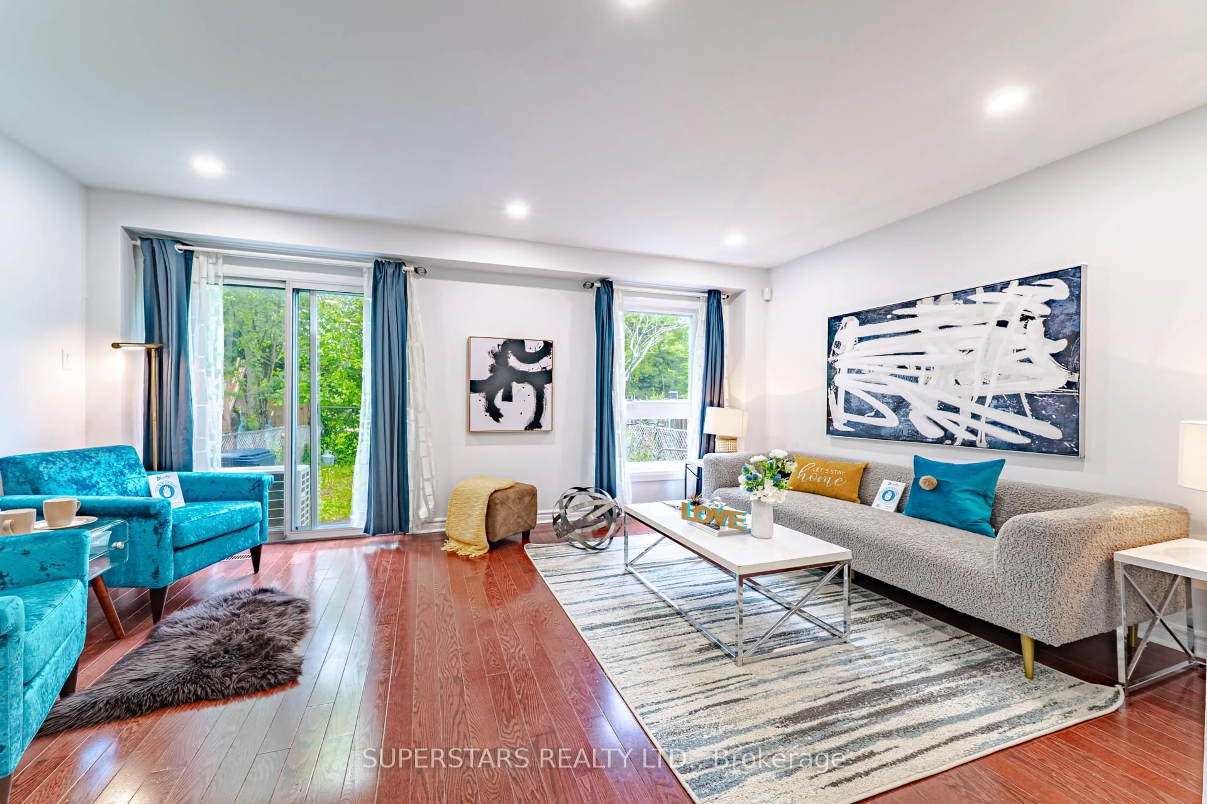 Living room with furniture, wood/laminate floor for 141 Whistling Hills Dr, Toronto Ontario M1V 3K7