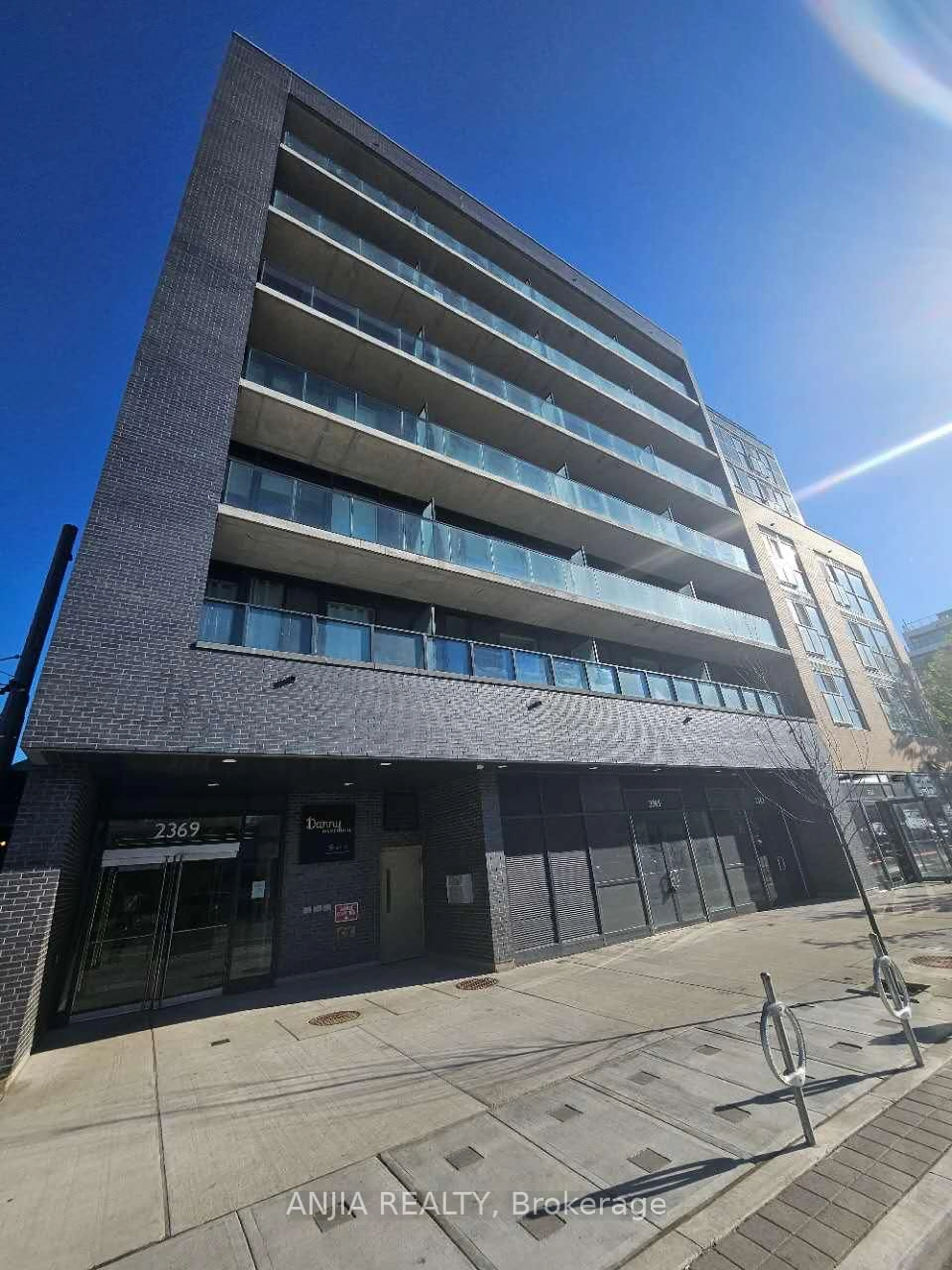 A pic from outside/outdoor area/front of a property/back of a property/a pic from drone, building for 2369 Danforth Ave #207, Toronto Ontario M4C 0B1