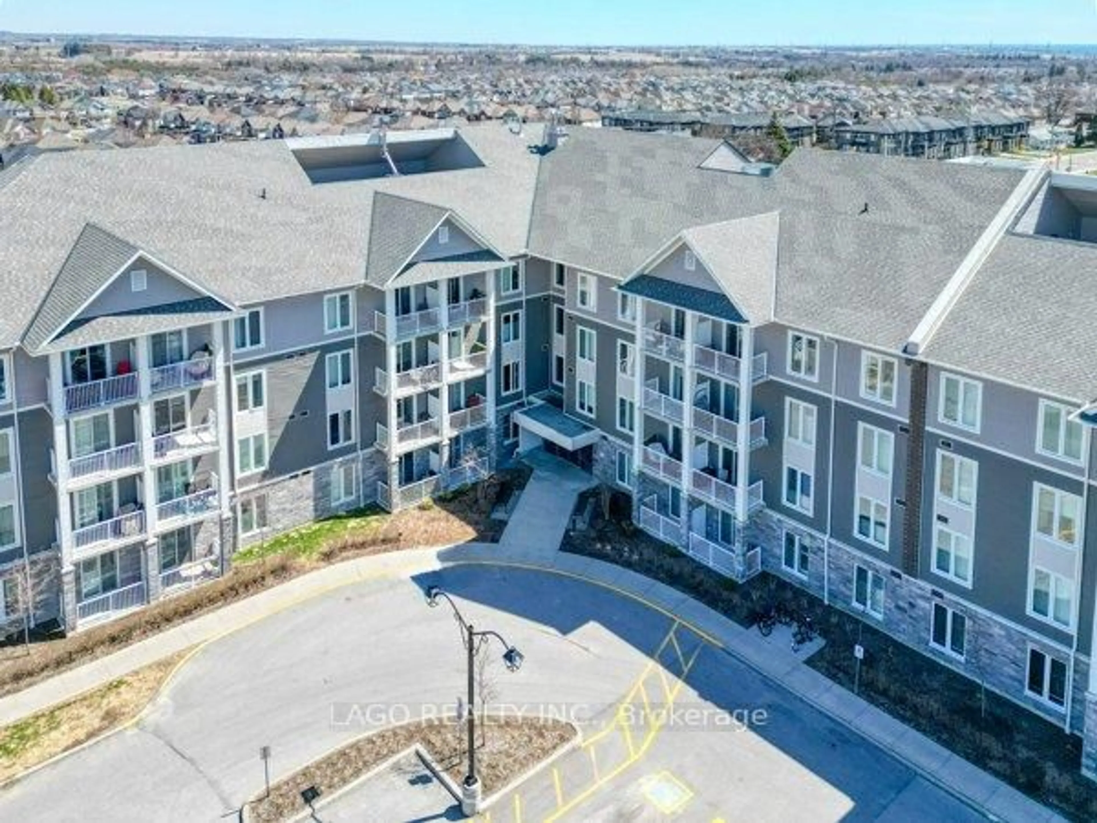 A pic from outside/outdoor area/front of a property/back of a property/a pic from drone, unknown for 290 Liberty St #217, Clarington Ontario L1C 0V5
