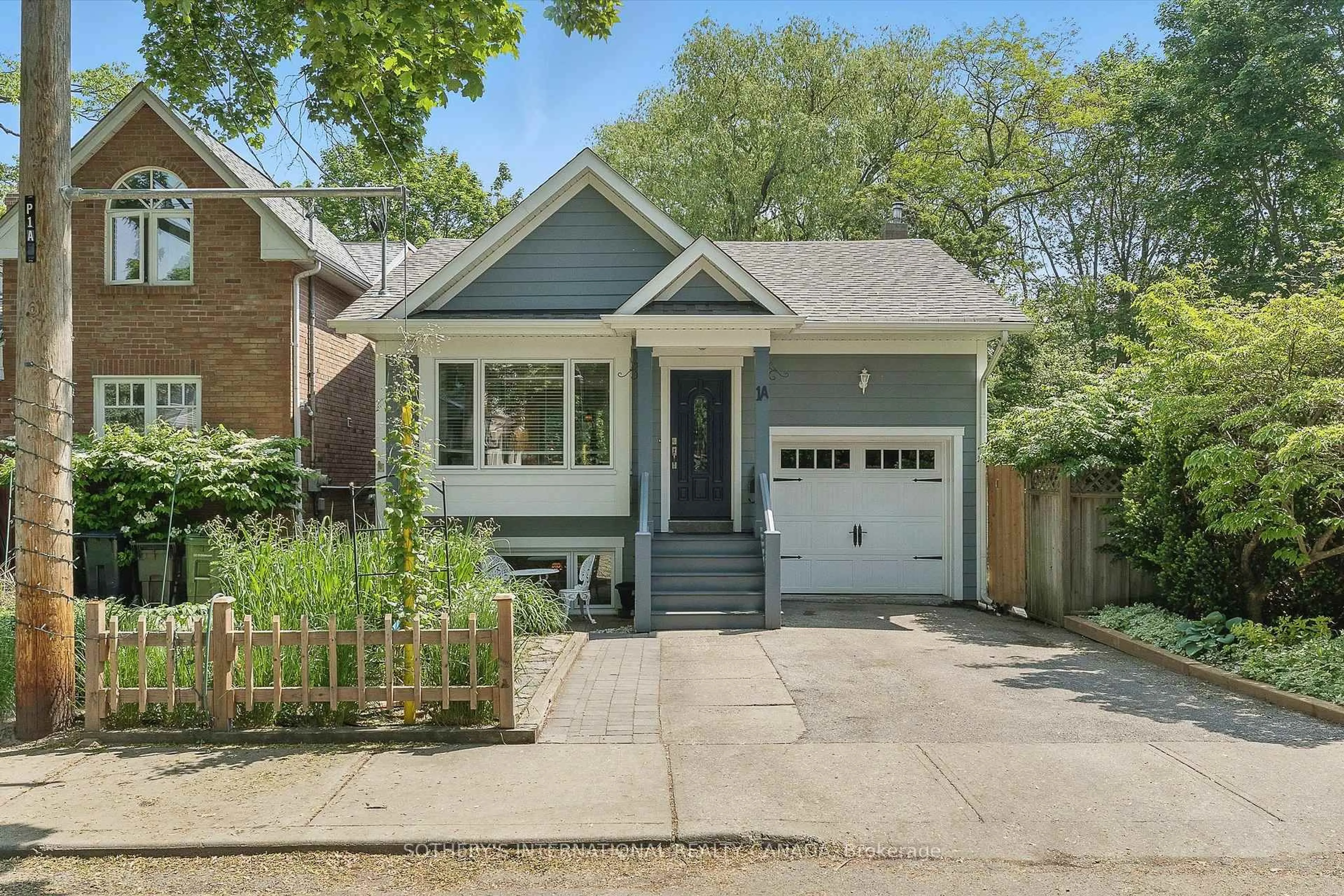 Home with brick exterior material, street for 1A Bowmore Rd, Toronto Ontario M4L 3H6