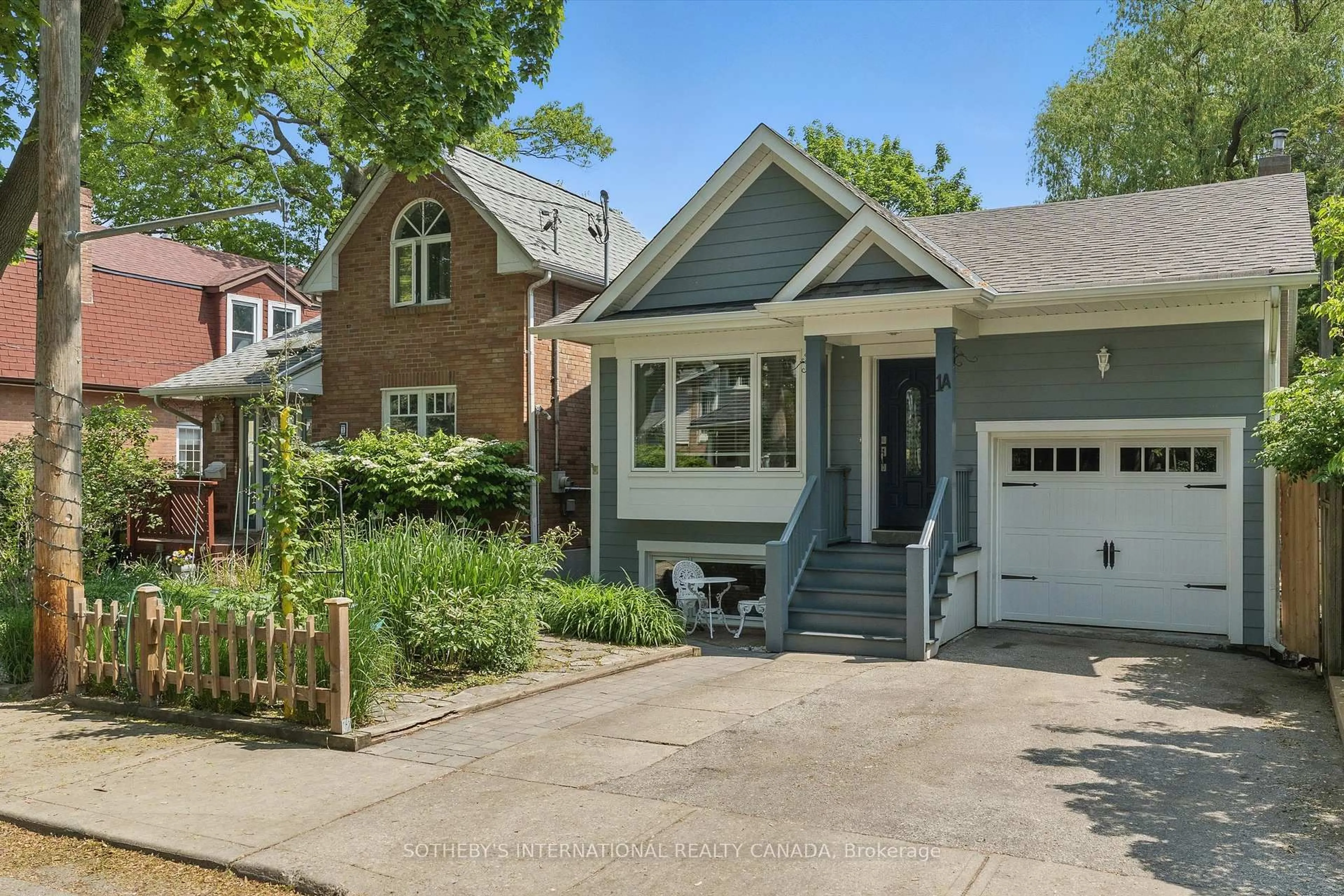 Home with brick exterior material, street for 1A Bowmore Rd, Toronto Ontario M4L 3H6