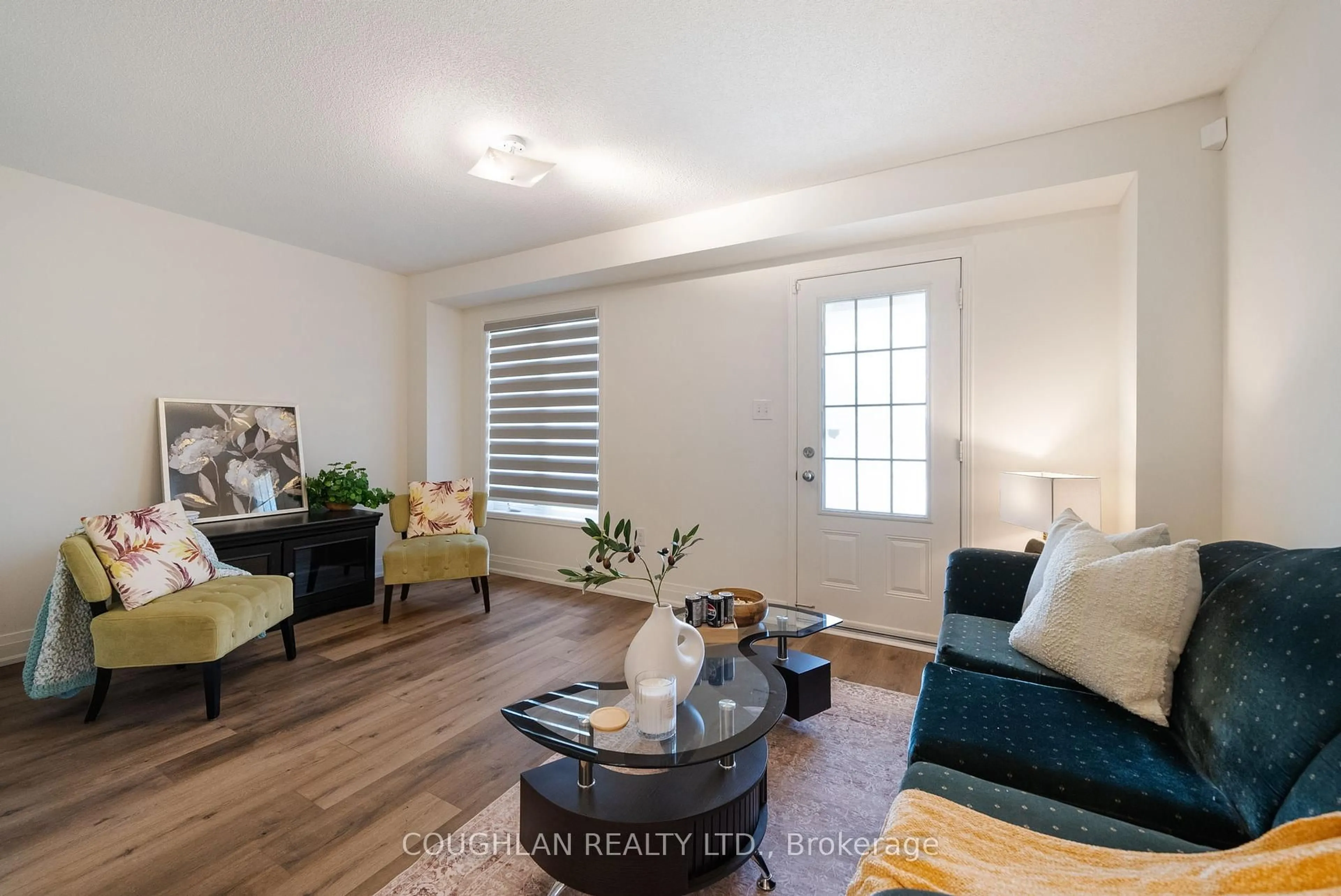 Living room with furniture, wood/laminate floor for 541 Rossland Rd, Ajax Ontario L1Z 0K7