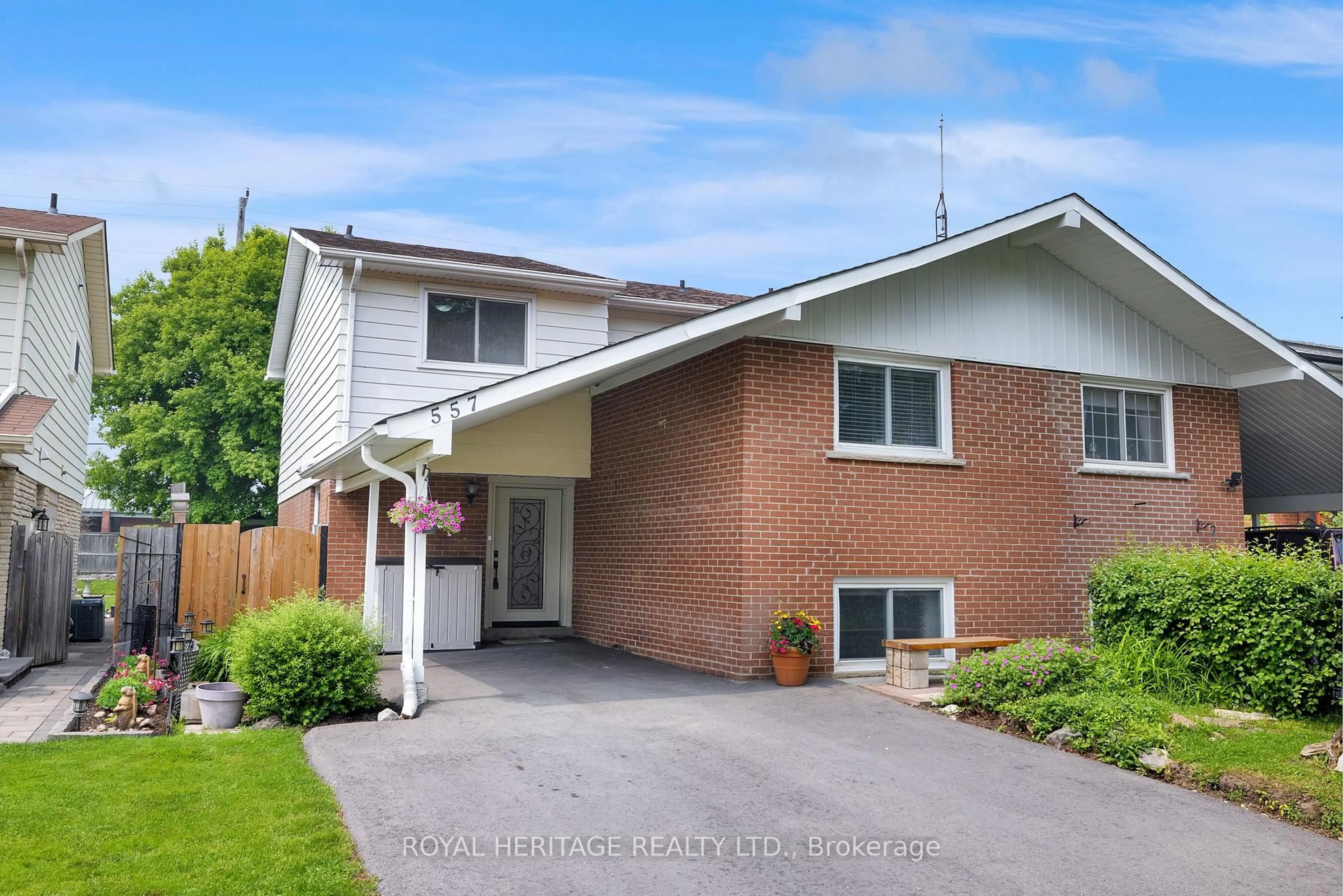 Home with brick exterior material, street for 557 Berwick Cres, Oshawa Ontario L1J 3E6