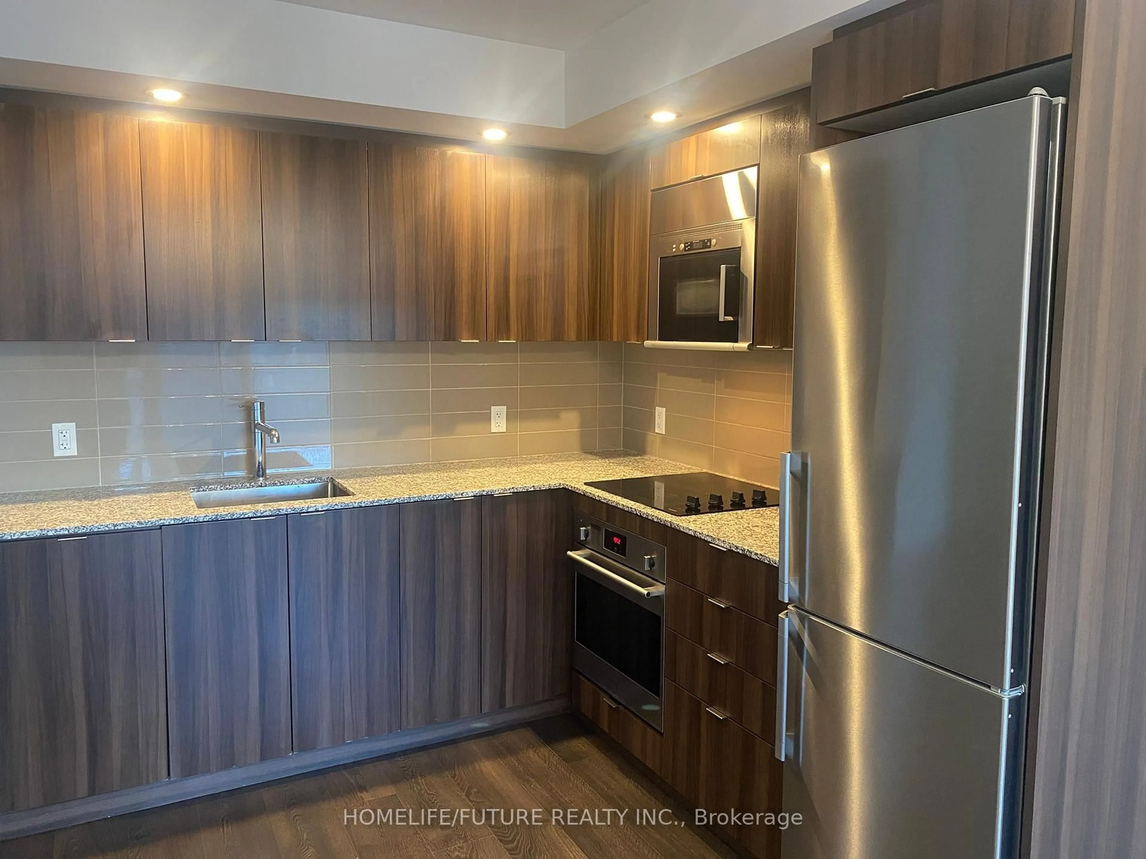 Standard kitchen, wood/laminate floor for 225 Village Green Sq #204, Toronto Ontario M1S 0N4