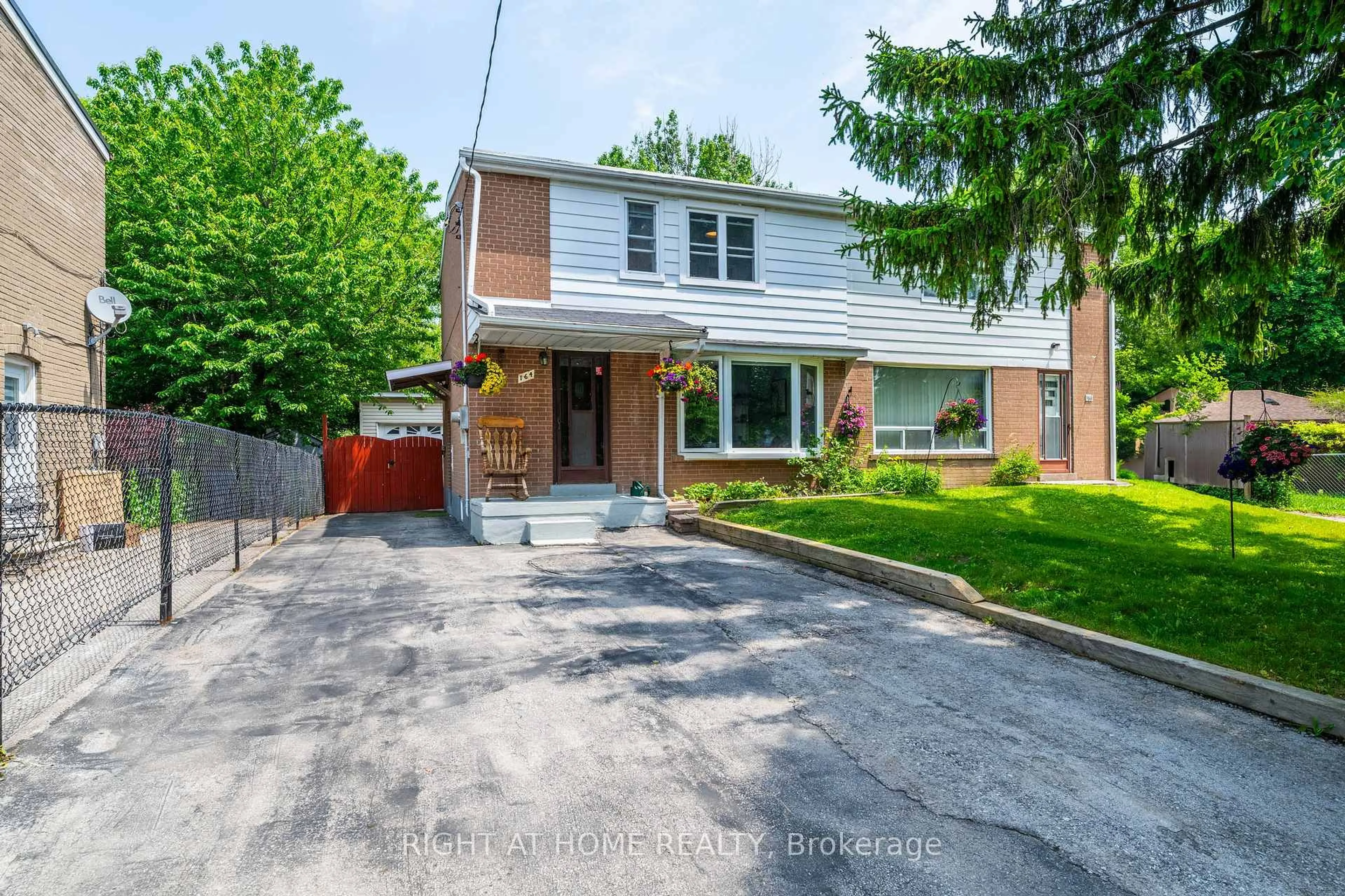 Home with brick exterior material, street for 164 Woodfern Dr, Toronto Ontario M1K 2L5