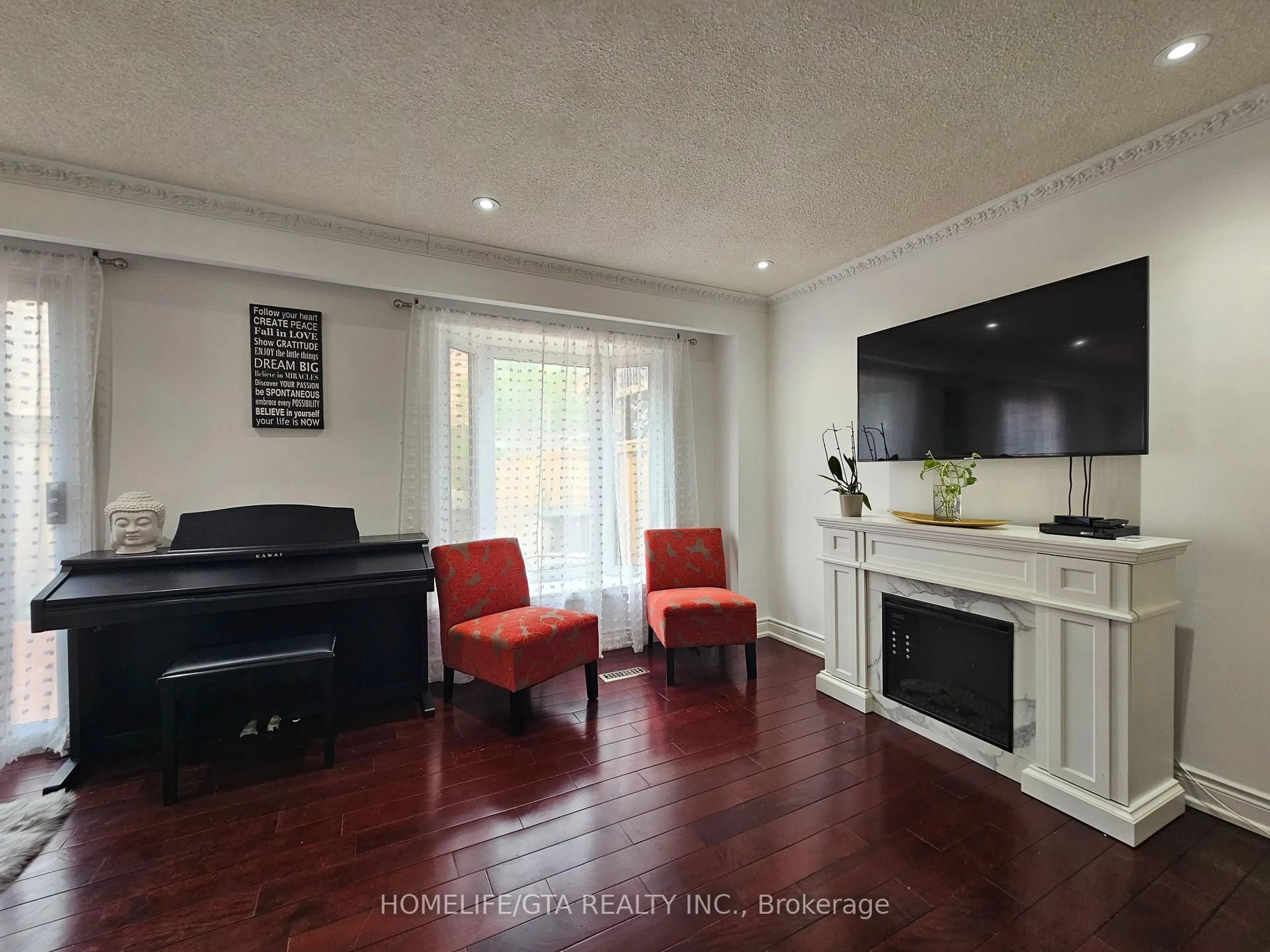 Living room with furniture, wood/laminate floor for 24 Bradstone Sq, Toronto Ontario M1B 1W2