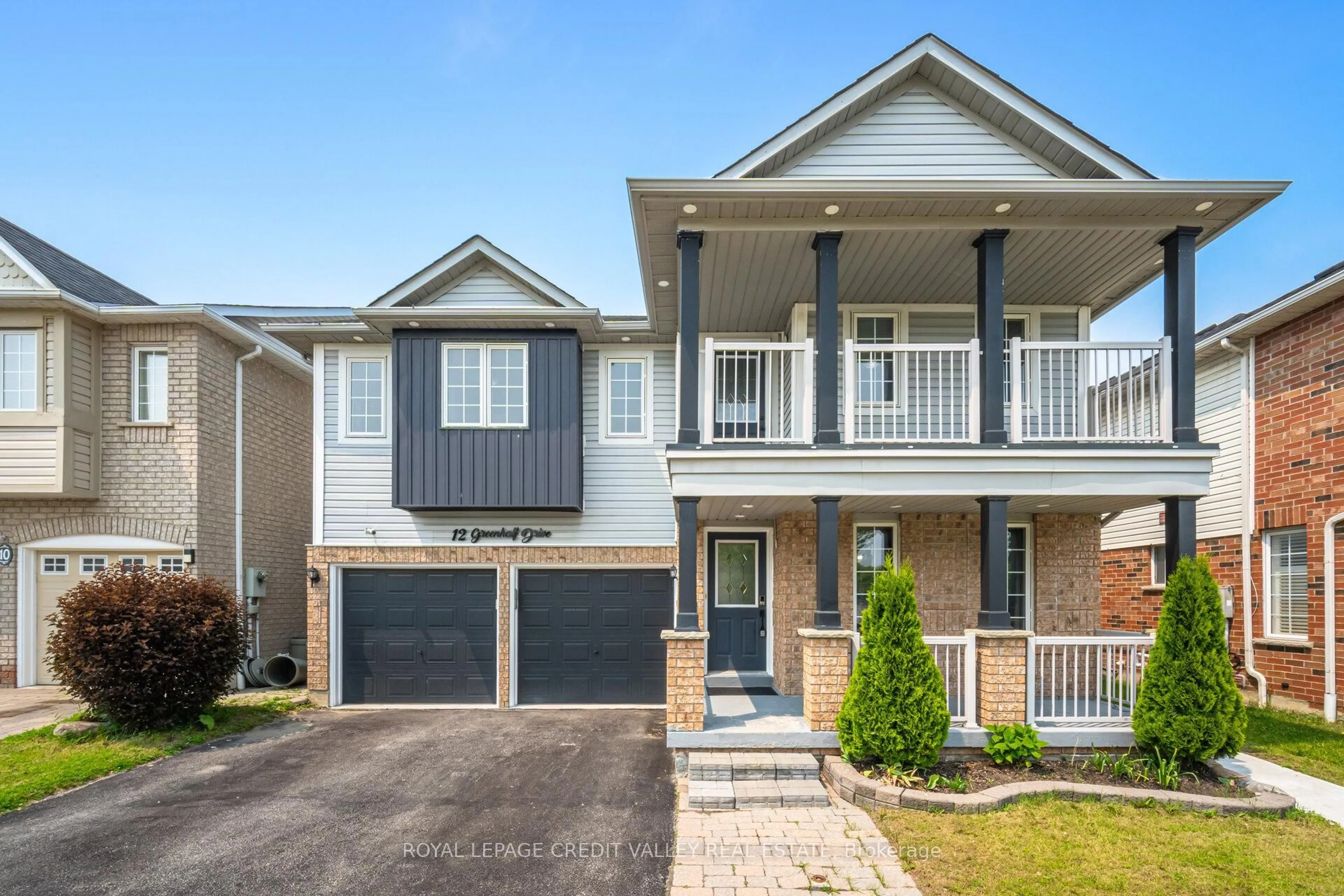Home with brick exterior material, street for 12 Greenhalf Dr, Ajax Ontario L1S 7N6
