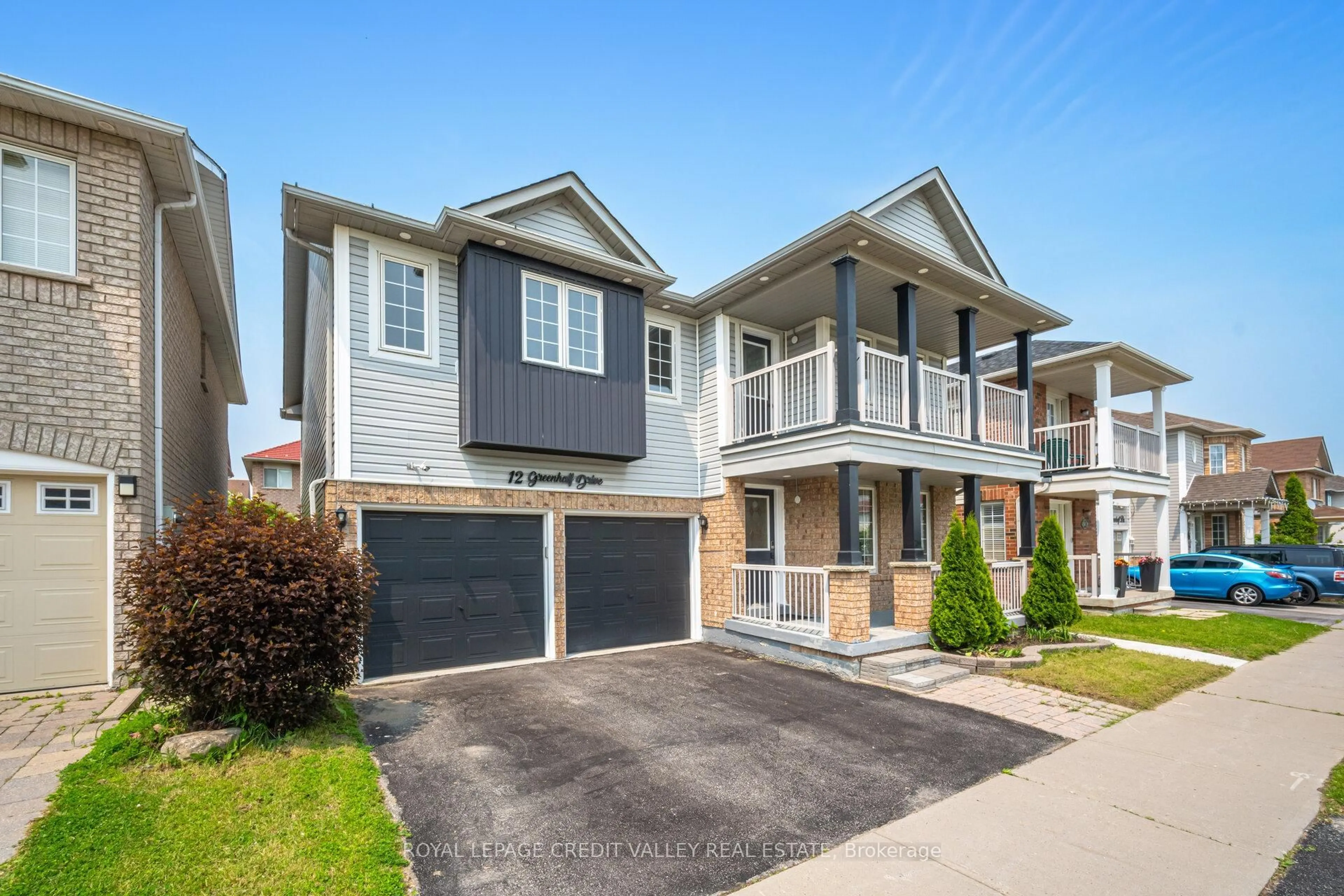 Home with vinyl exterior material, street for 12 Greenhalf Dr, Ajax Ontario L1S 7N6