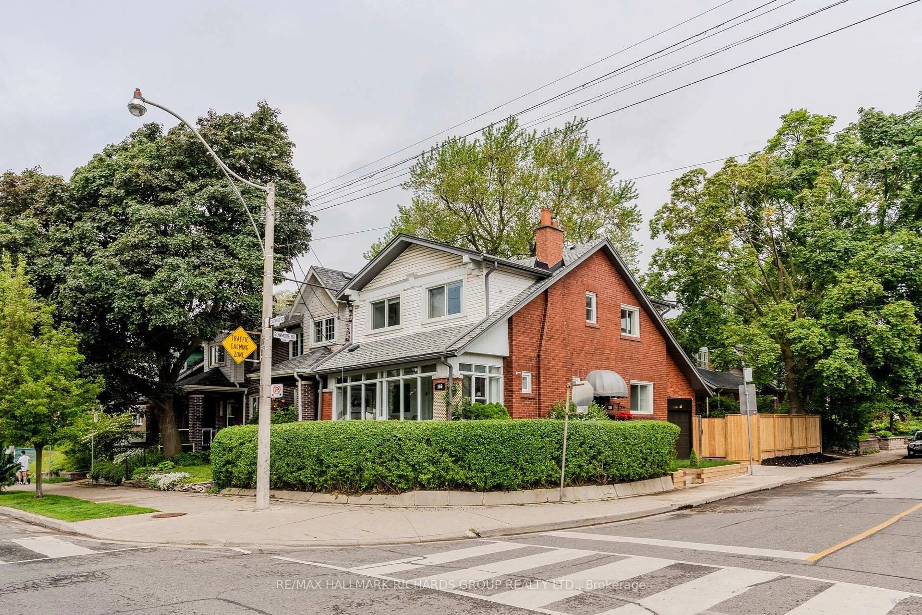 Home with brick exterior material, street for 156 Eastwood Rd, Toronto Ontario M4L 2C9