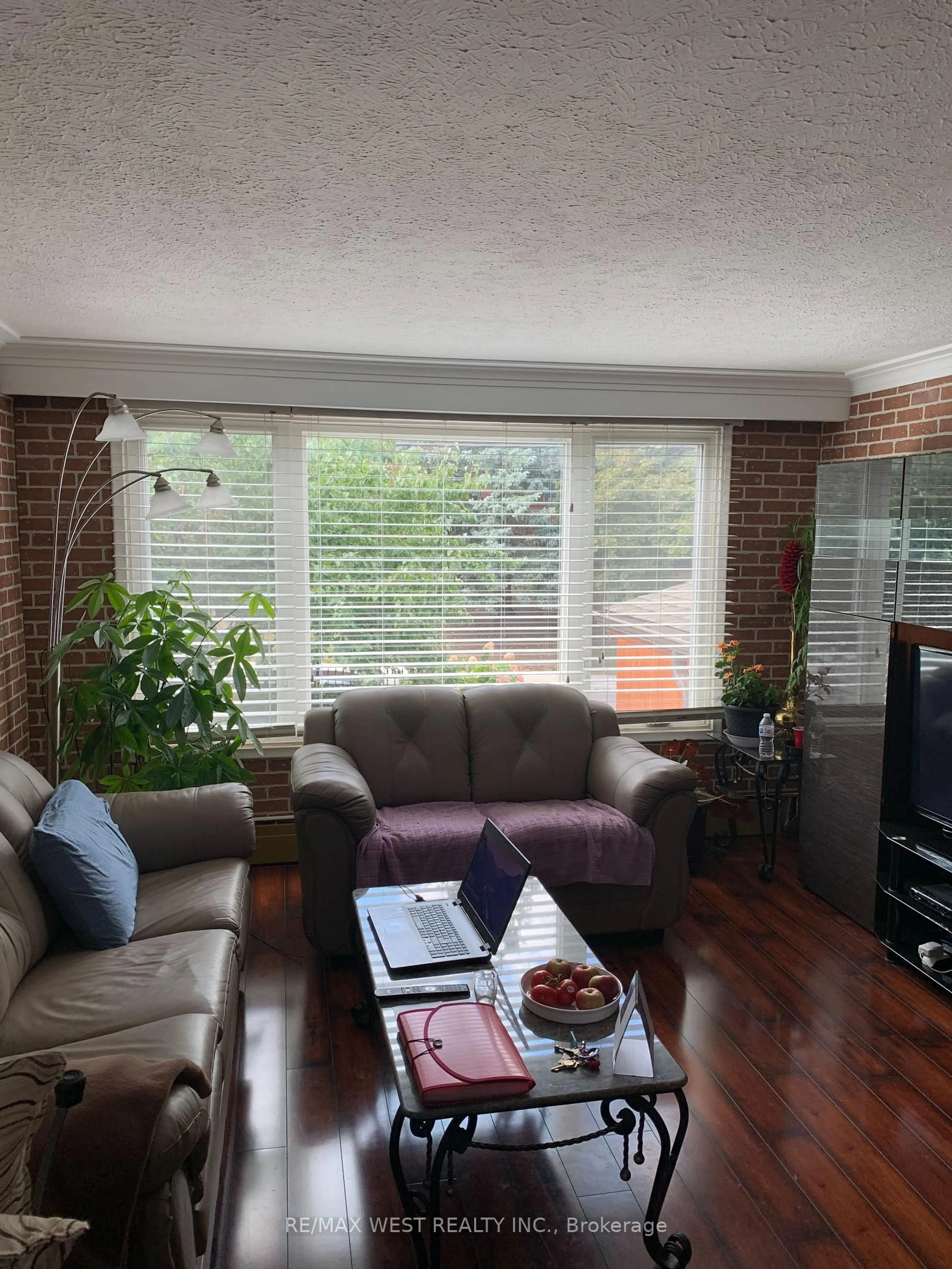 Living room with furniture, wood/laminate floor for 263 Oak Park Ave, Toronto Ontario M4C 4N4