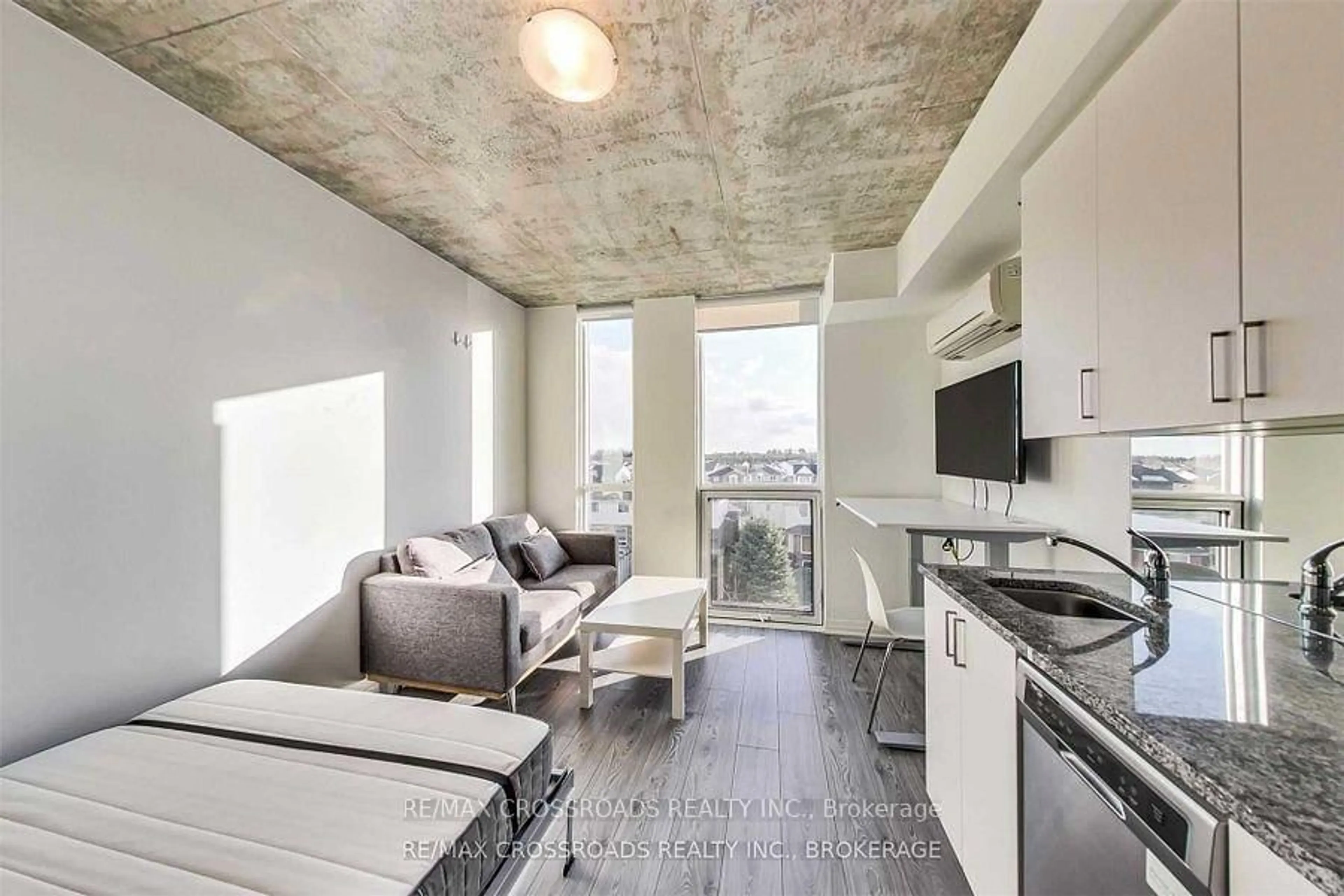 Open concept kitchen, cement floor for 1900 Simcoe St #326, Oshawa Ontario L1G 4X9