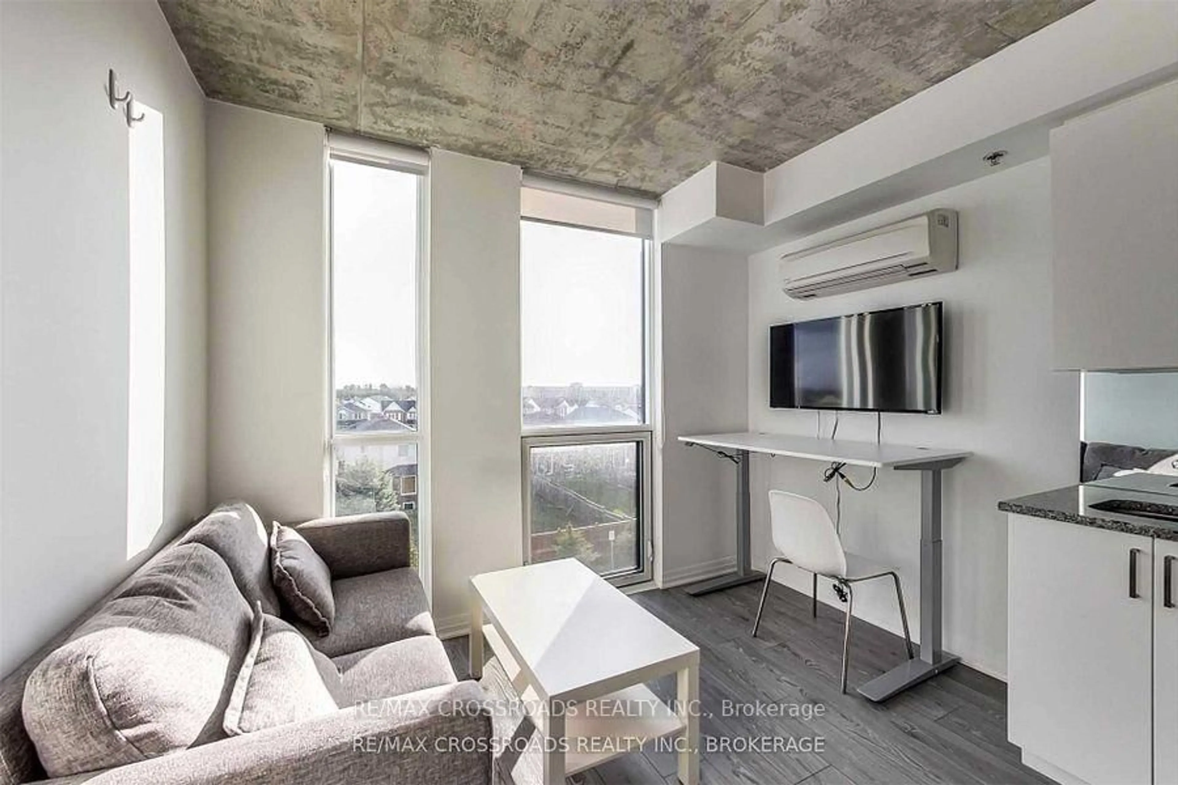 Living room with furniture, cement floor for 1900 Simcoe St #326, Oshawa Ontario L1G 4X9