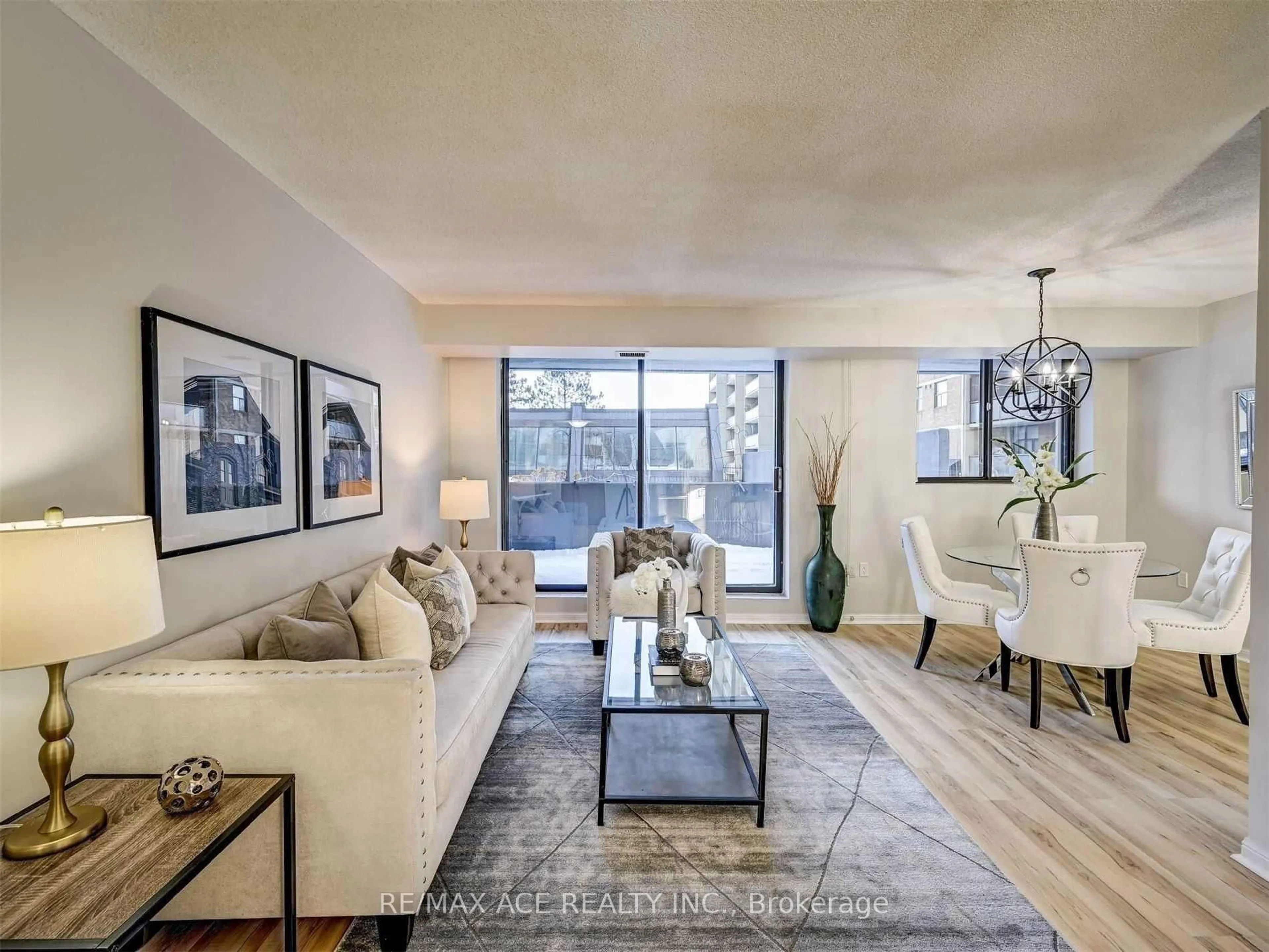 Living room with furniture, unknown for 757 Victoria Park Ave #207, Toronto Ontario M4C 5N8