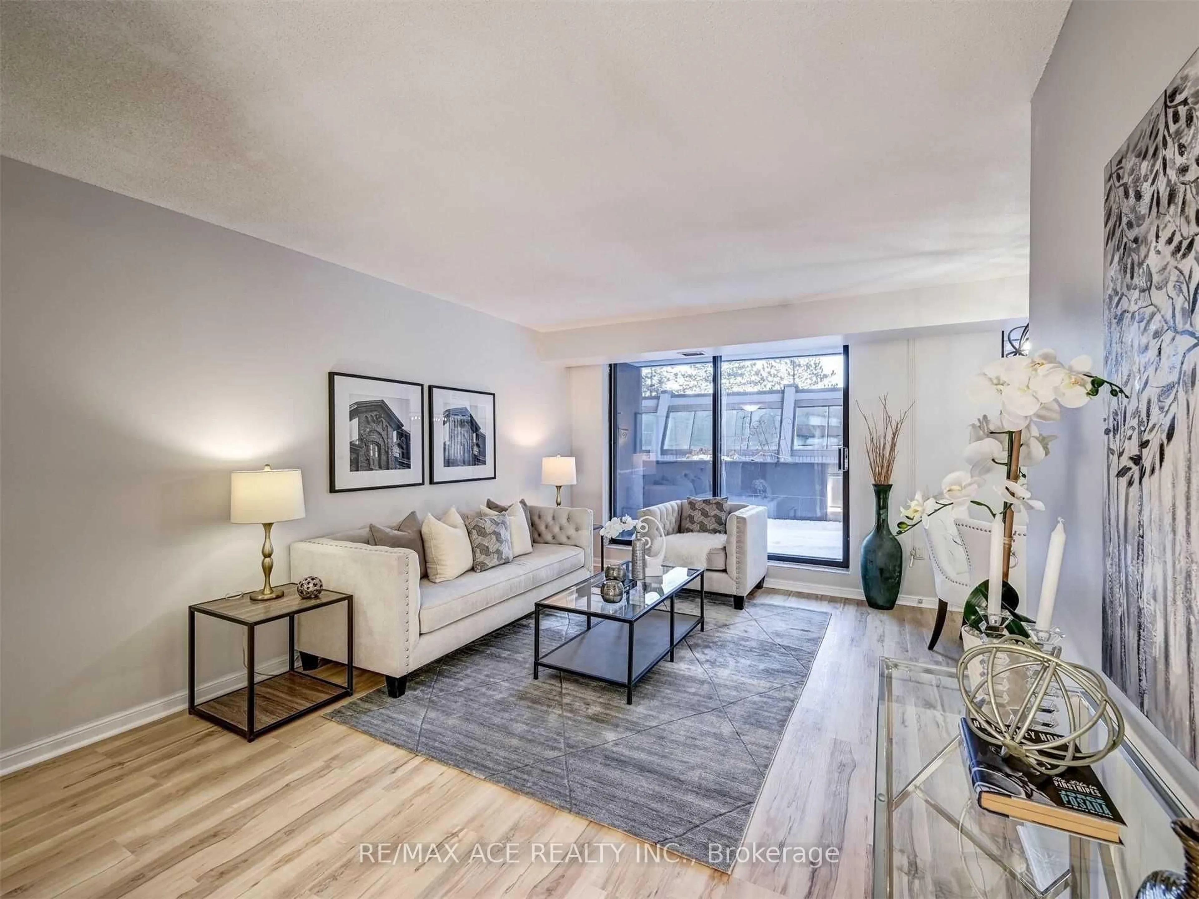 Living room with furniture, unknown for 757 Victoria Park Ave #207, Toronto Ontario M4C 5N8