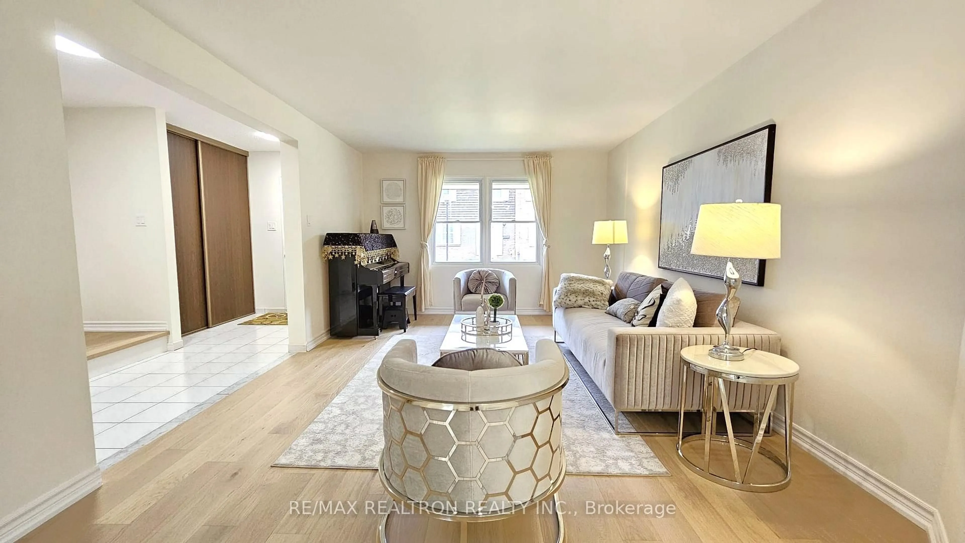 Living room with furniture, wood/laminate floor for 15 Brimwood Blvd #27, Toronto Ontario M1V 1E1