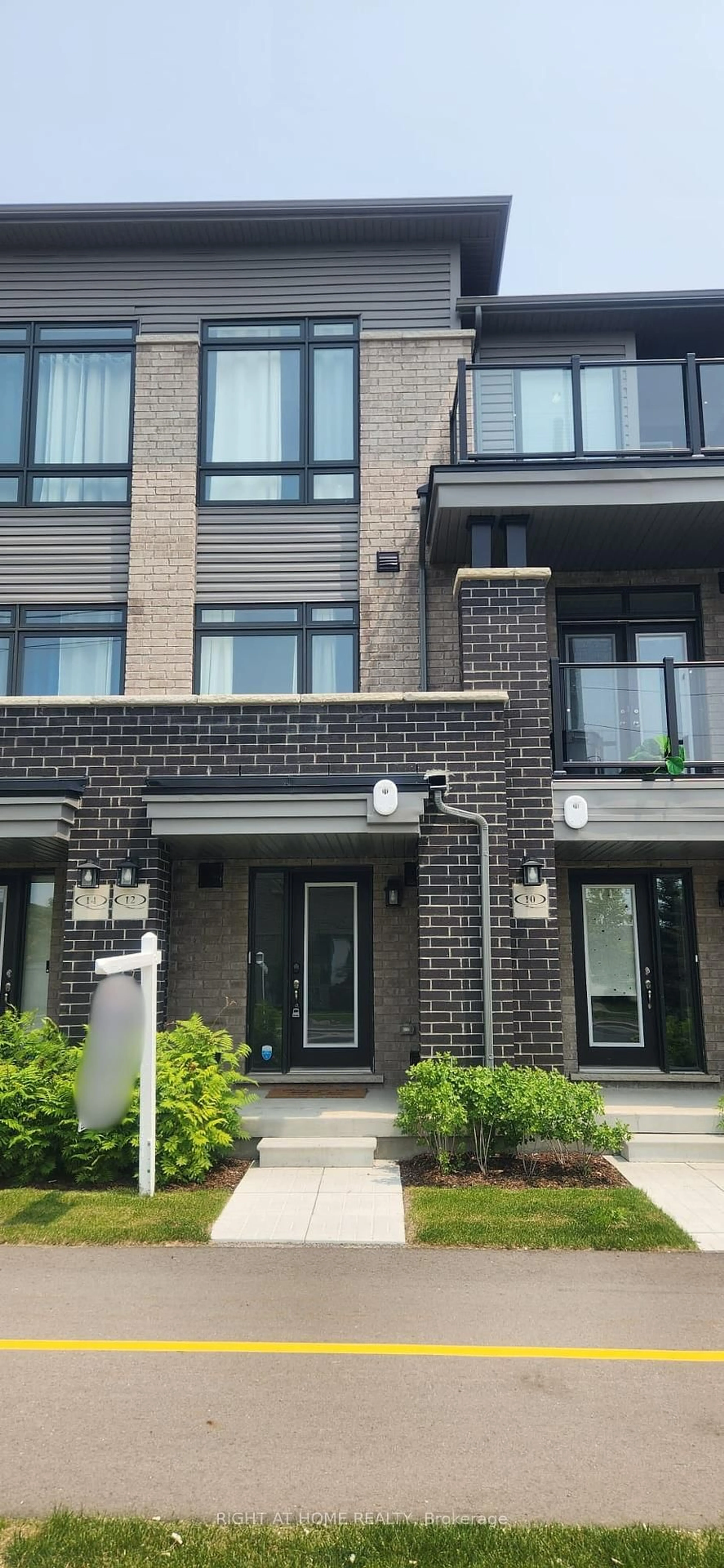 Home with brick exterior material, street for 12 Emmas Way, Whitby Ontario L1R 0S7