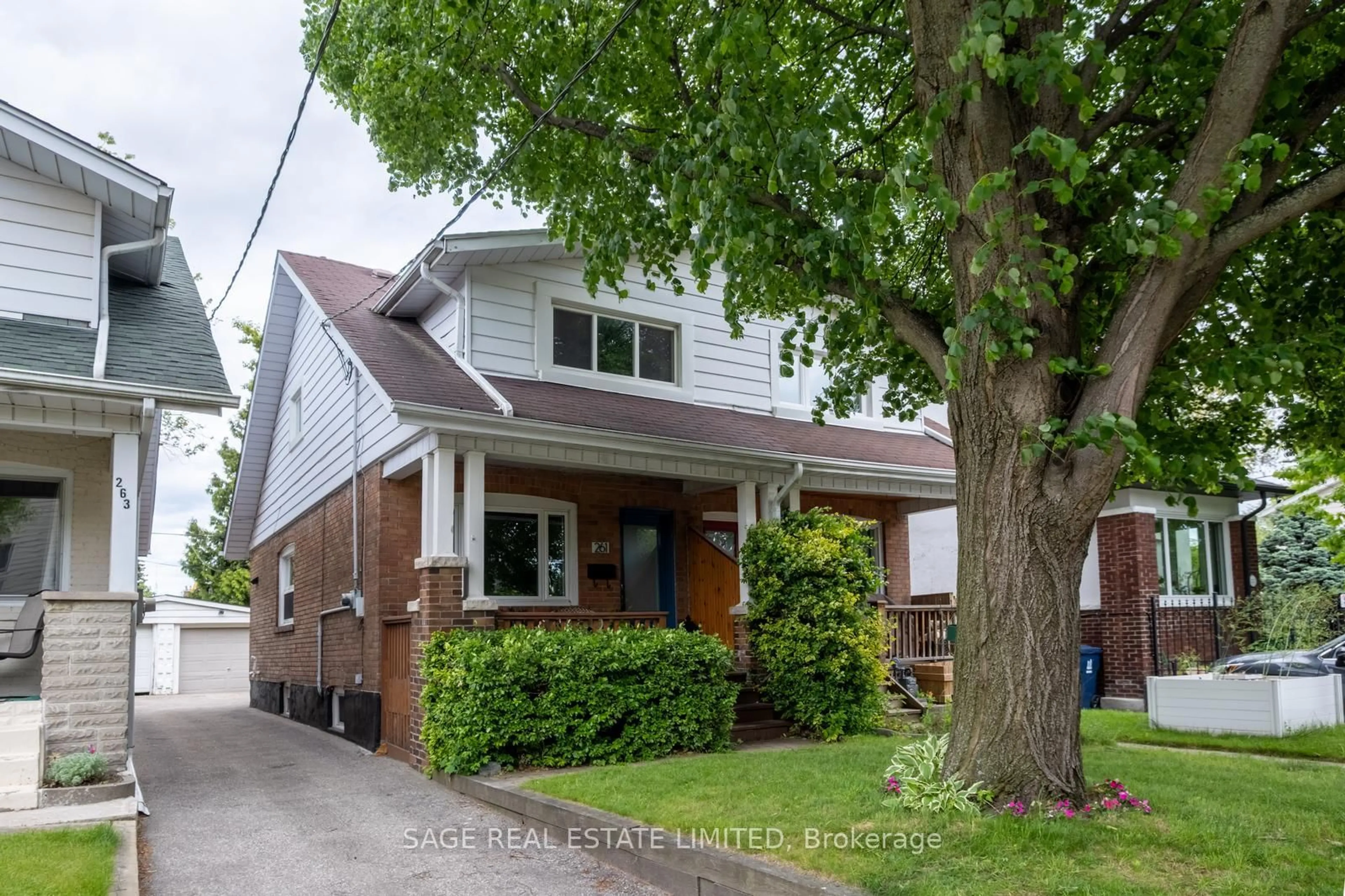 Home with brick exterior material, street for 261 Monarch Park Ave, Toronto Ontario M4J 4S6