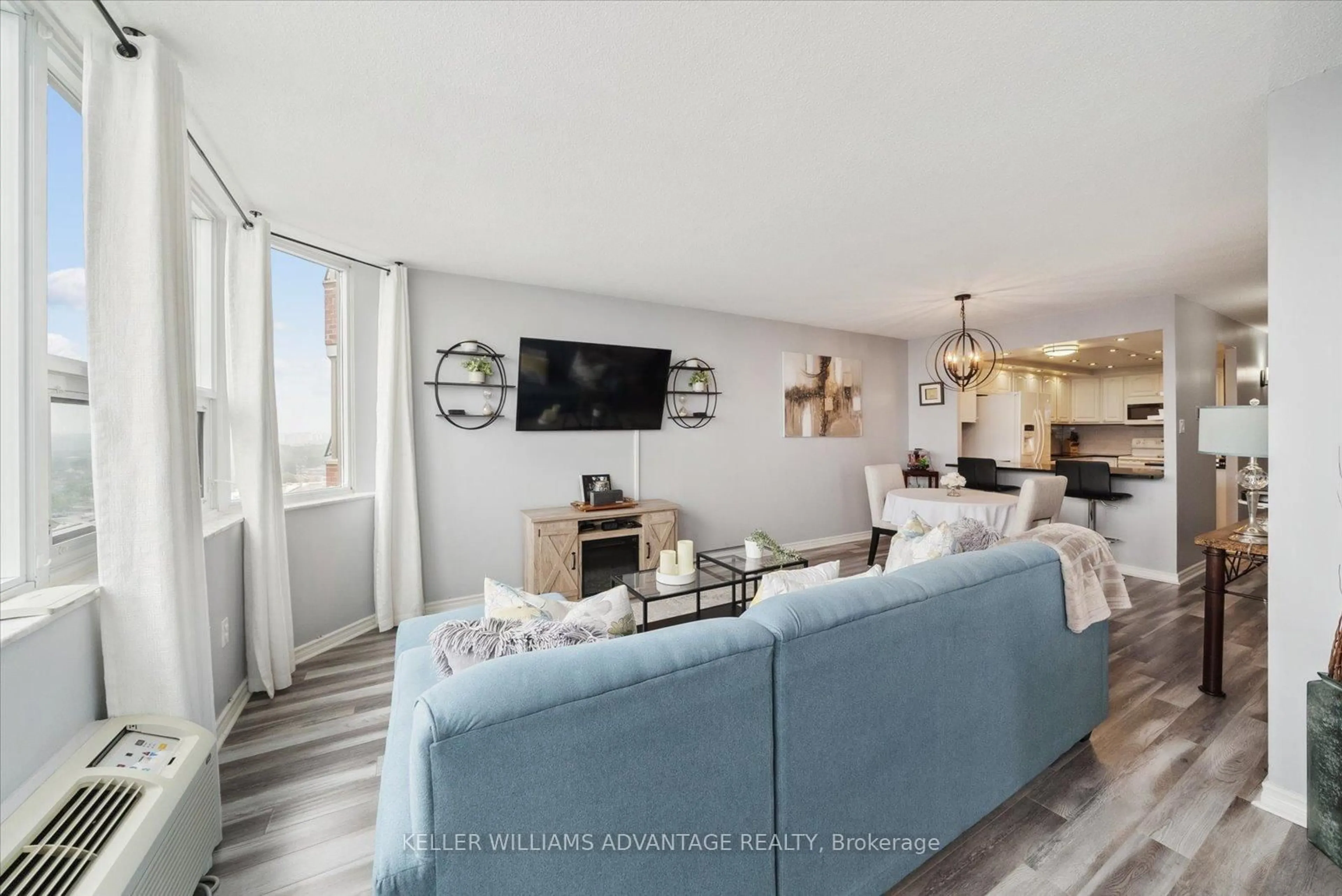 Living room with furniture, unknown for 121 Ling Rd #1804, Toronto Ontario M1E 4Y2