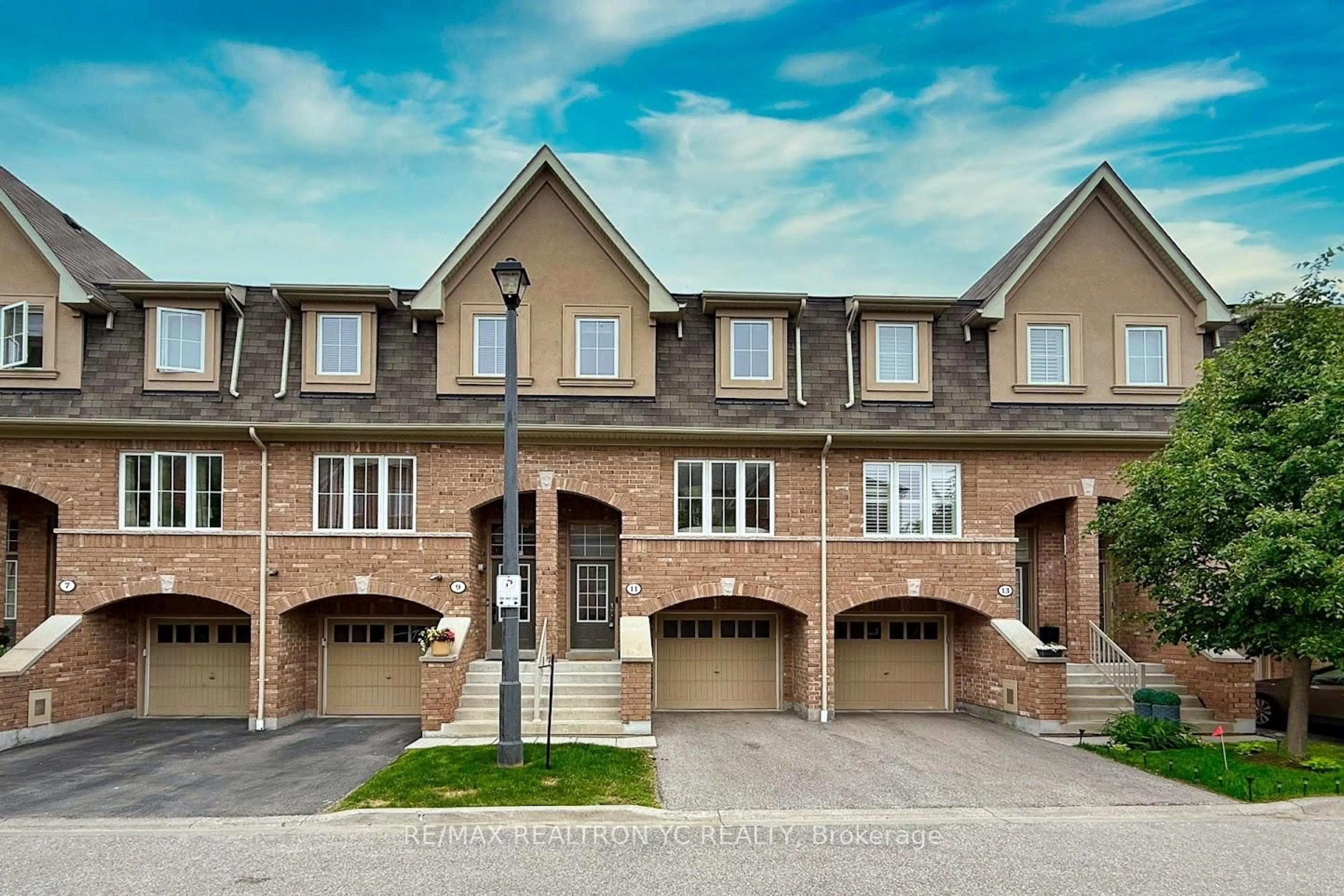 Home with brick exterior material, street for 11 Reevesmere Lane, Ajax Ontario L1Z 0L3