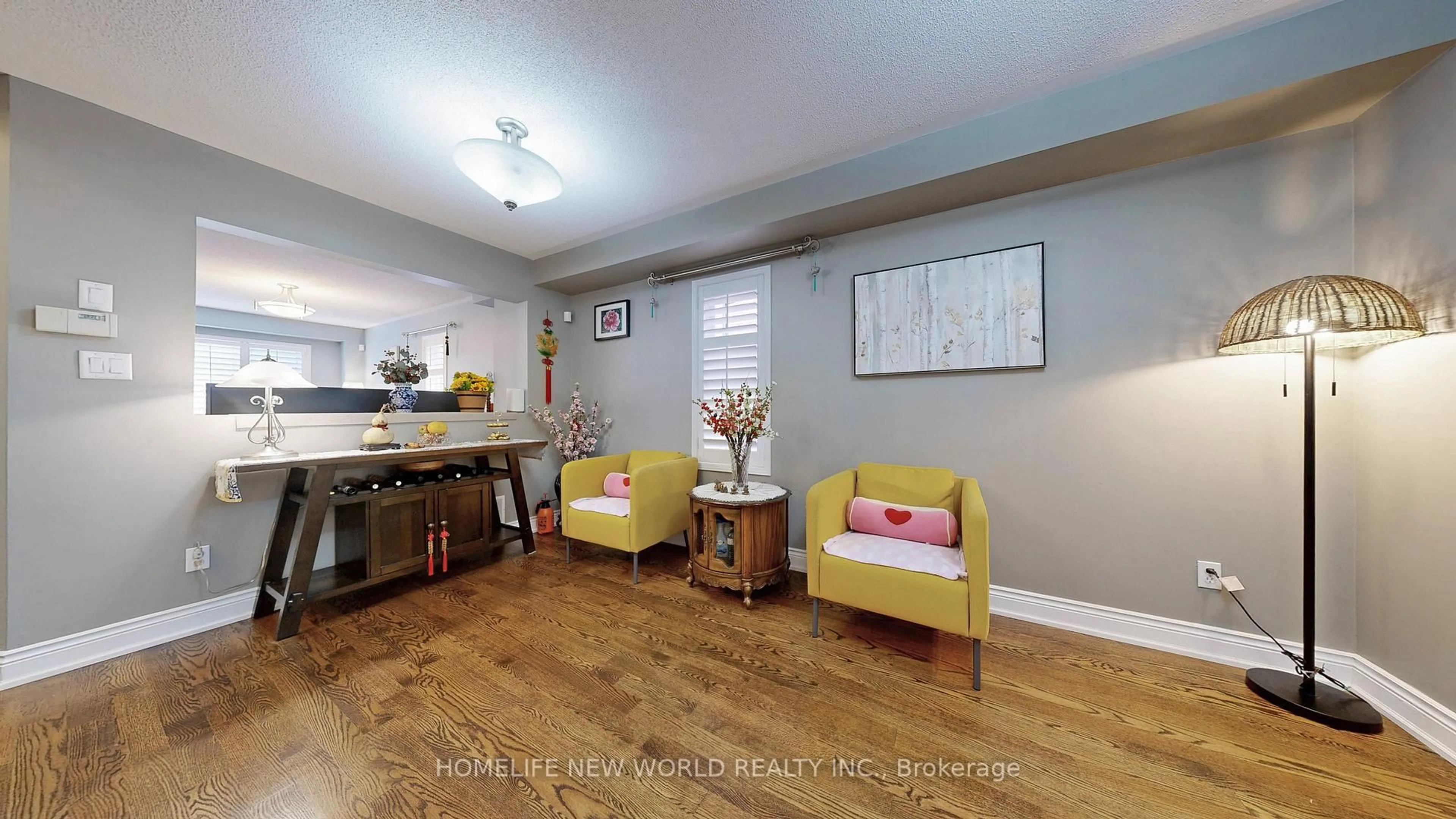 Living room with furniture, wood/laminate floor for 33 Tasker Cres, Ajax Ontario L1Z 1N8