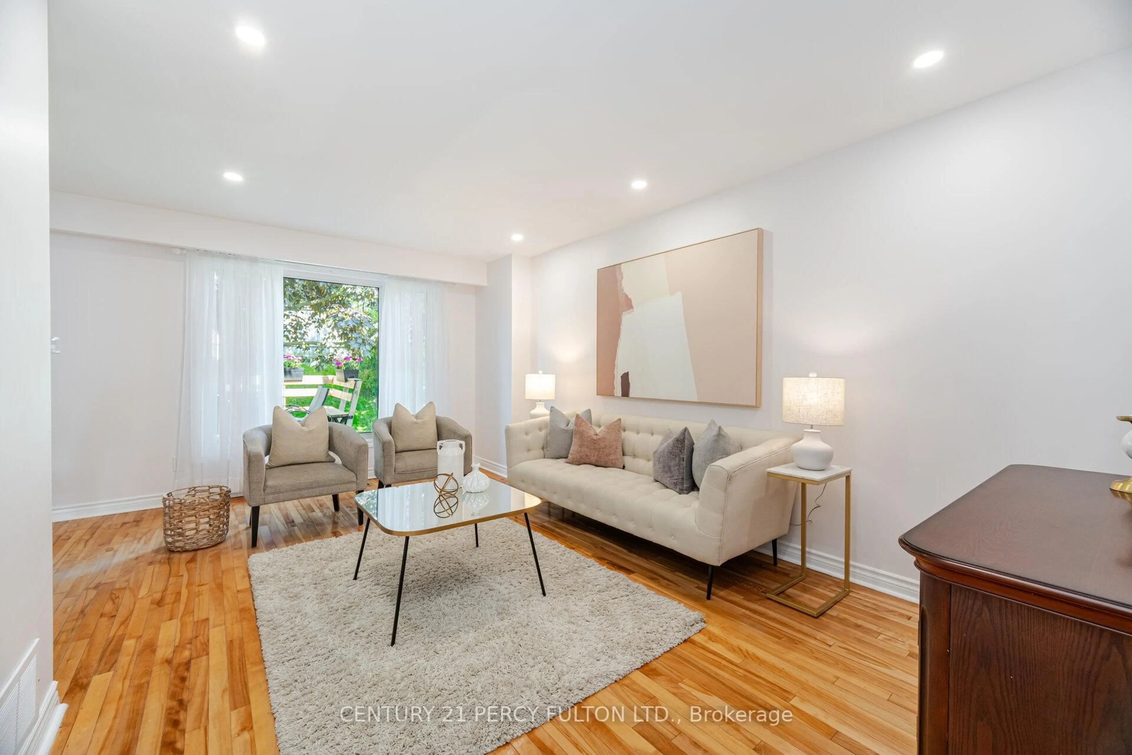Living room with furniture, wood/laminate floor for 541 Creekview Circ, Pickering Ontario L1W 2Z9