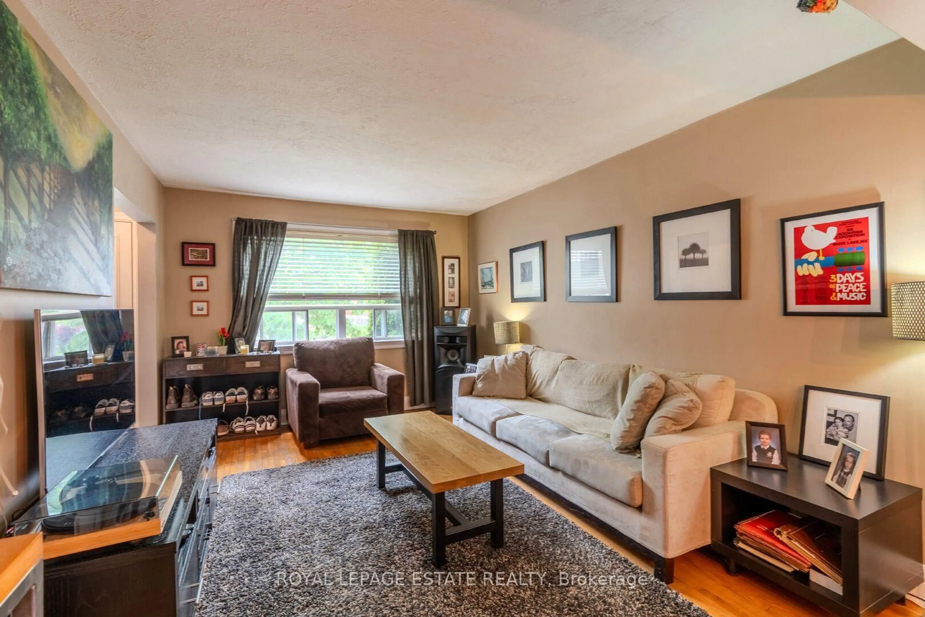 Living room with furniture, wood/laminate floor for 210 Westview Blvd, Toronto Ontario M4B 3J5