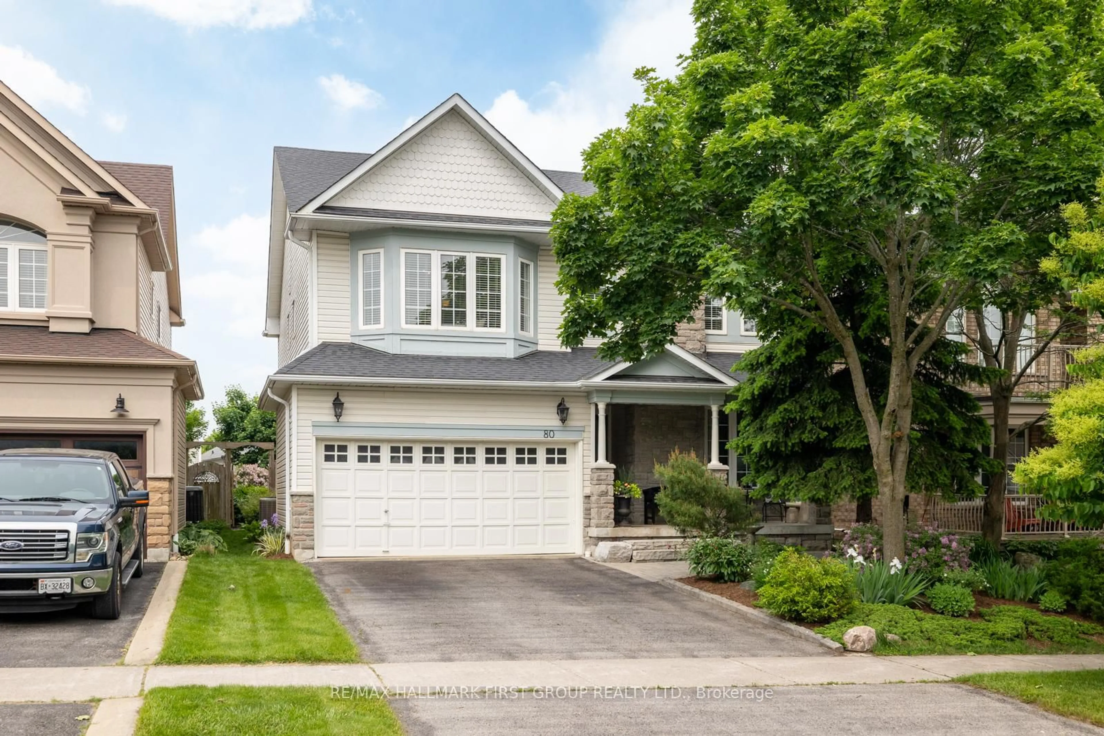 Home with vinyl exterior material, street for 80 Darius Harns Dr, Whitby Ontario L1M 2G2