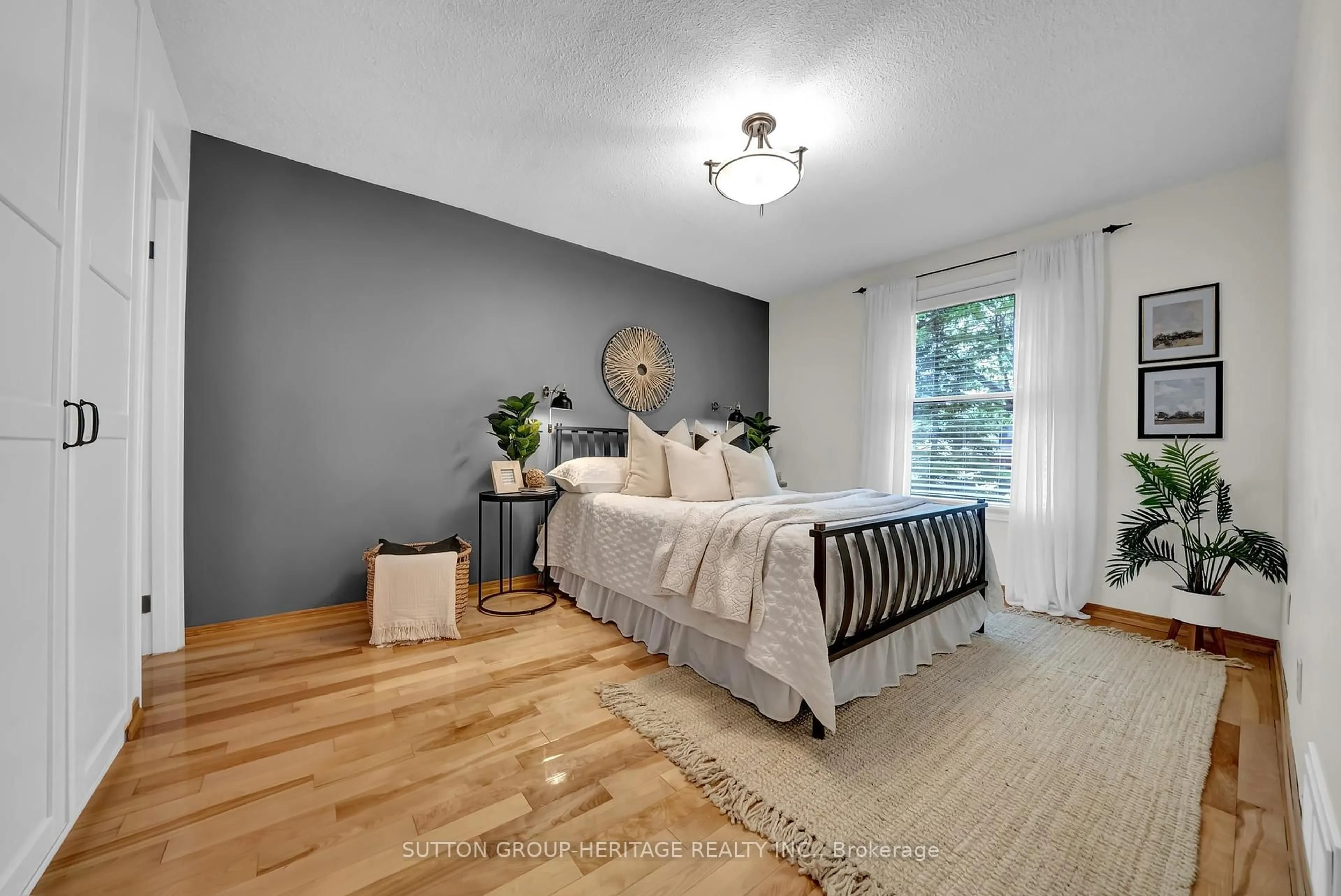 Bedroom with bed, wood/laminate floor for 117 Guthrie Cres, Whitby Ontario L1P 1A6