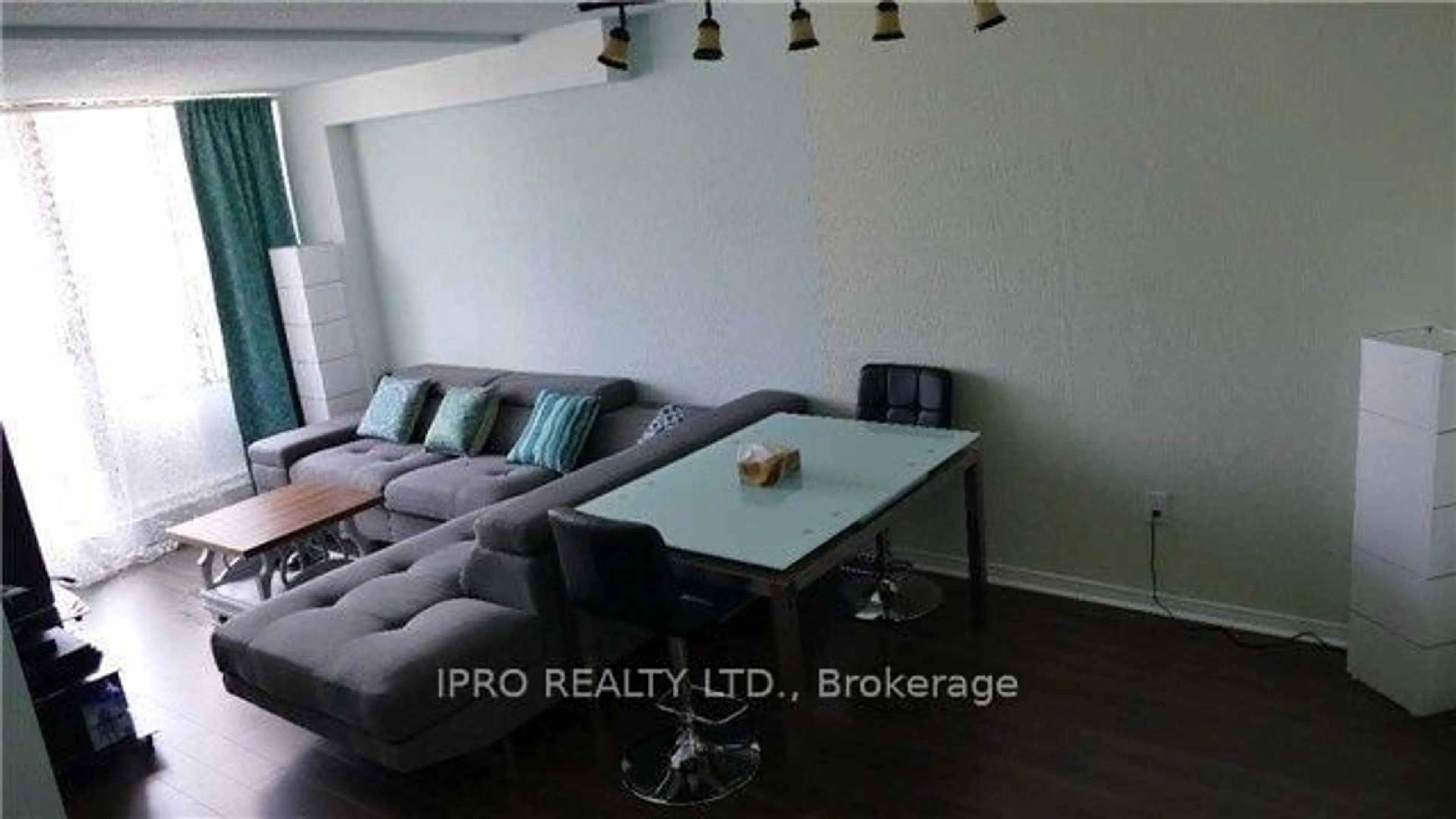Living room with furniture, wood/laminate floor for 5580 Sheppard Ave #209, Toronto Ontario M1B 2L3