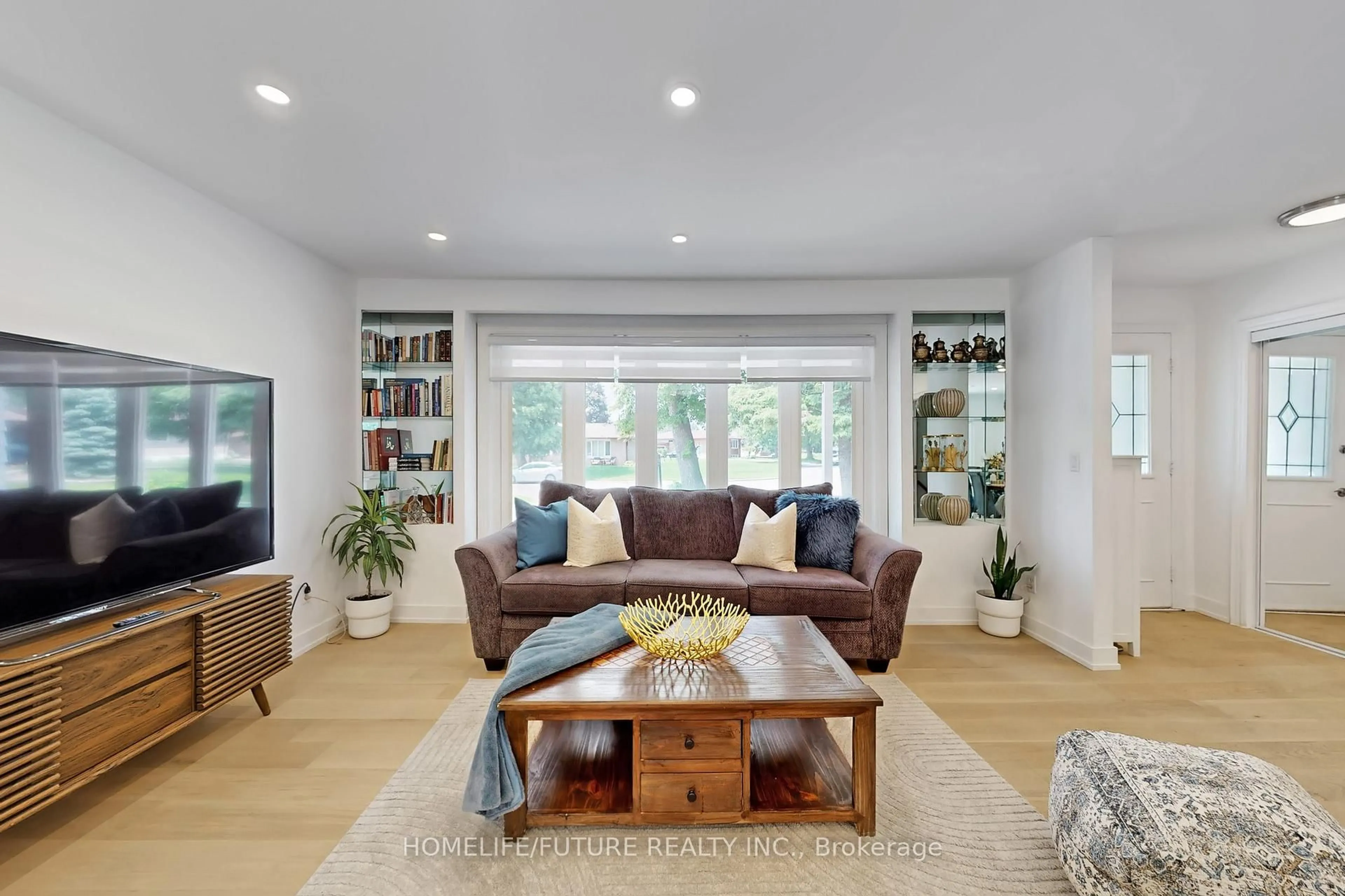 Living room with furniture, wood/laminate floor for 243 Acadia Dr, Oshawa Ontario L1G 1X9