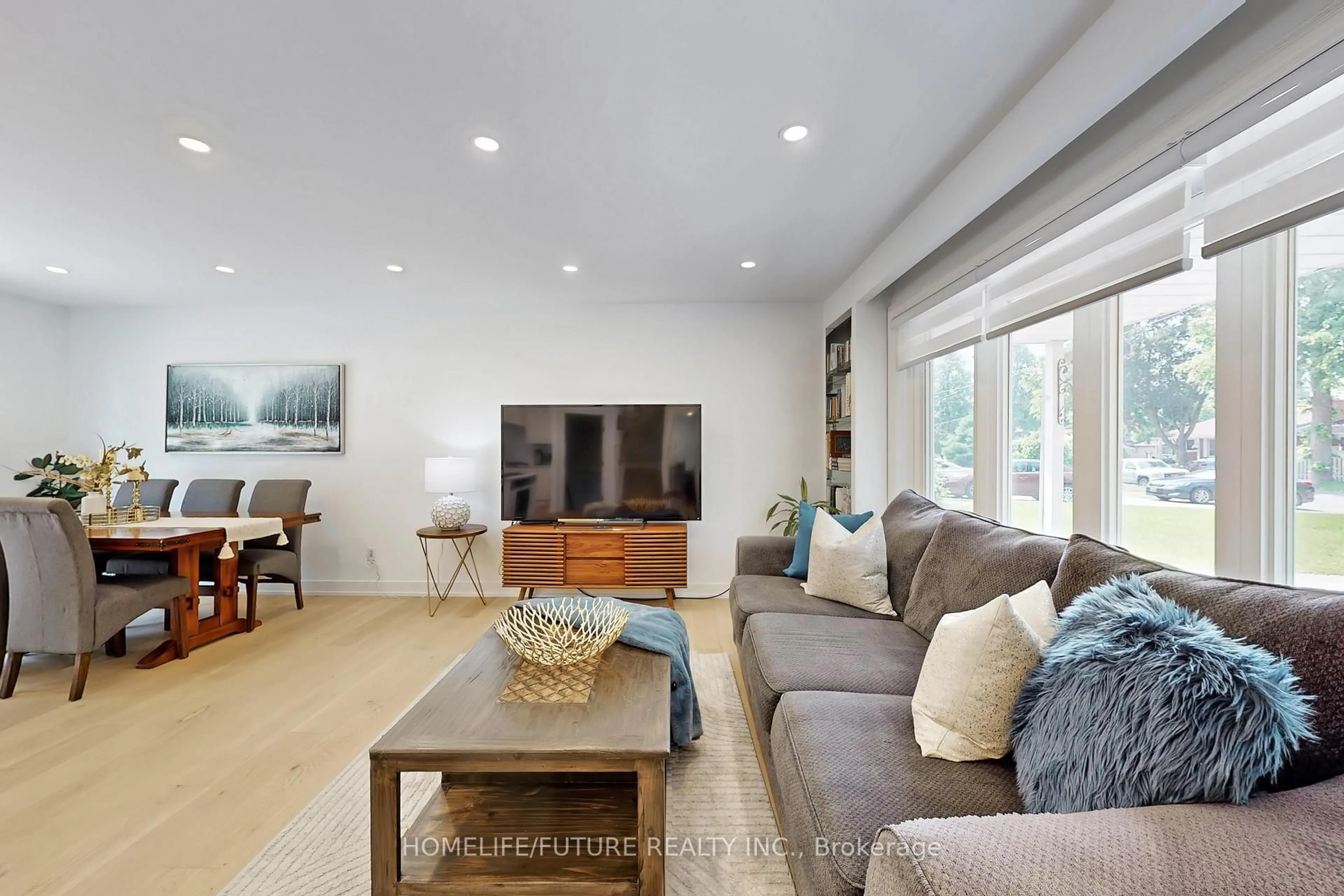 Living room with furniture, wood/laminate floor for 243 Acadia Dr, Oshawa Ontario L1G 1X9