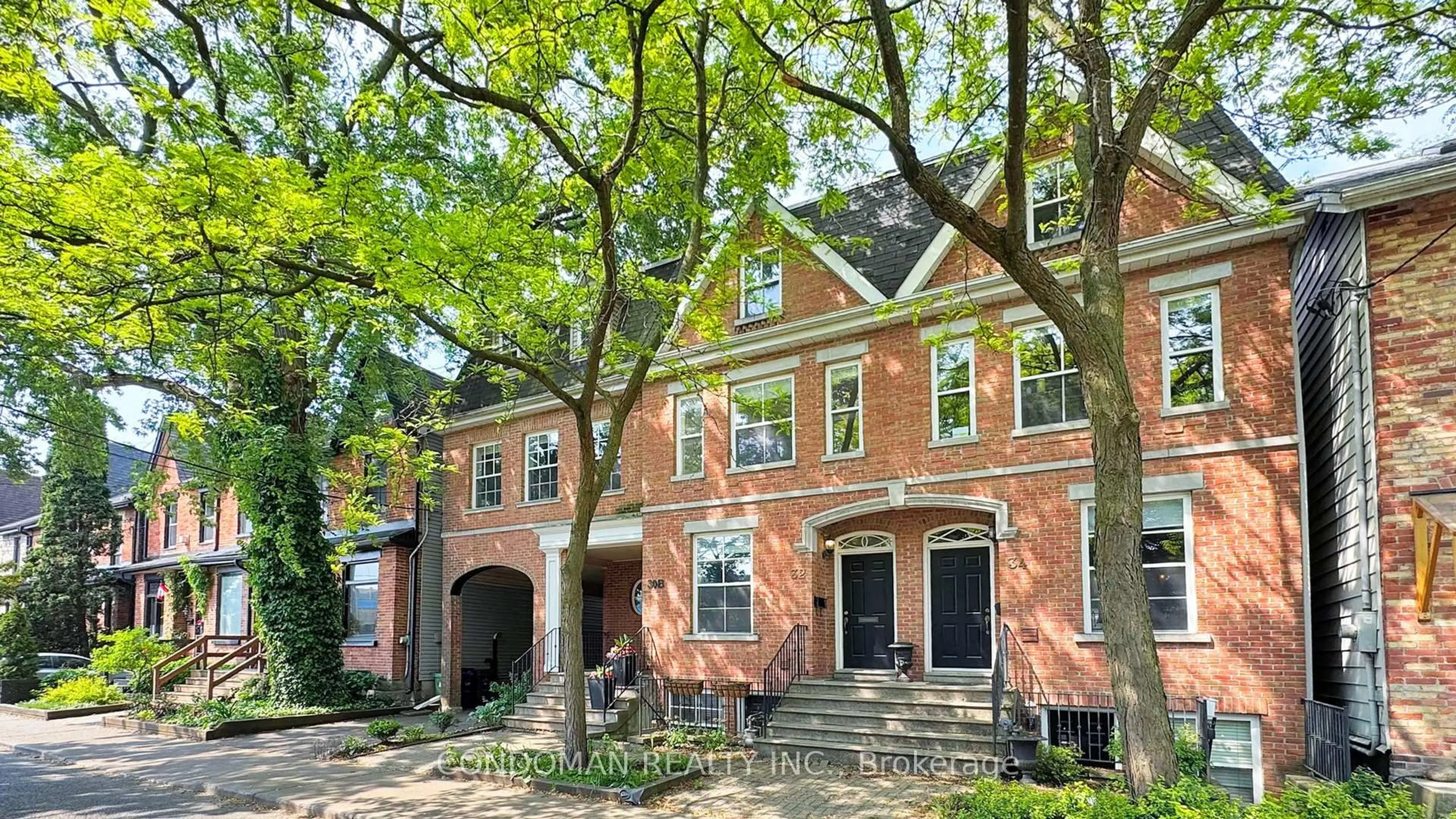 Home with brick exterior material, street for 32 De Grassi St, Toronto Ontario M4M 2K3