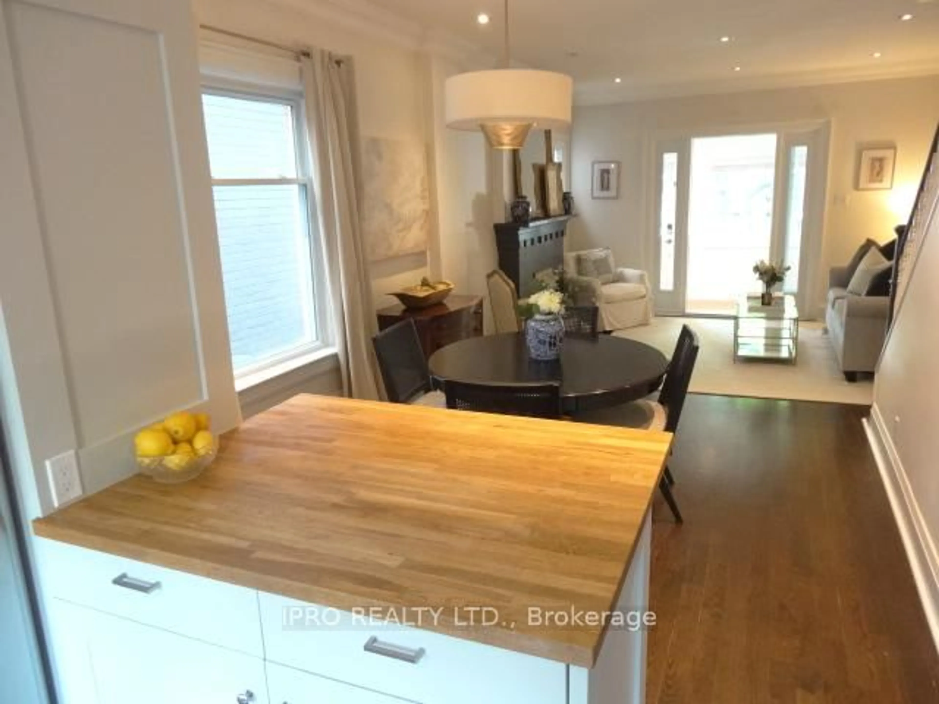 Open concept kitchen, wood/laminate floor for 86 Bertmount Ave, Toronto Ontario M4M 2X9
