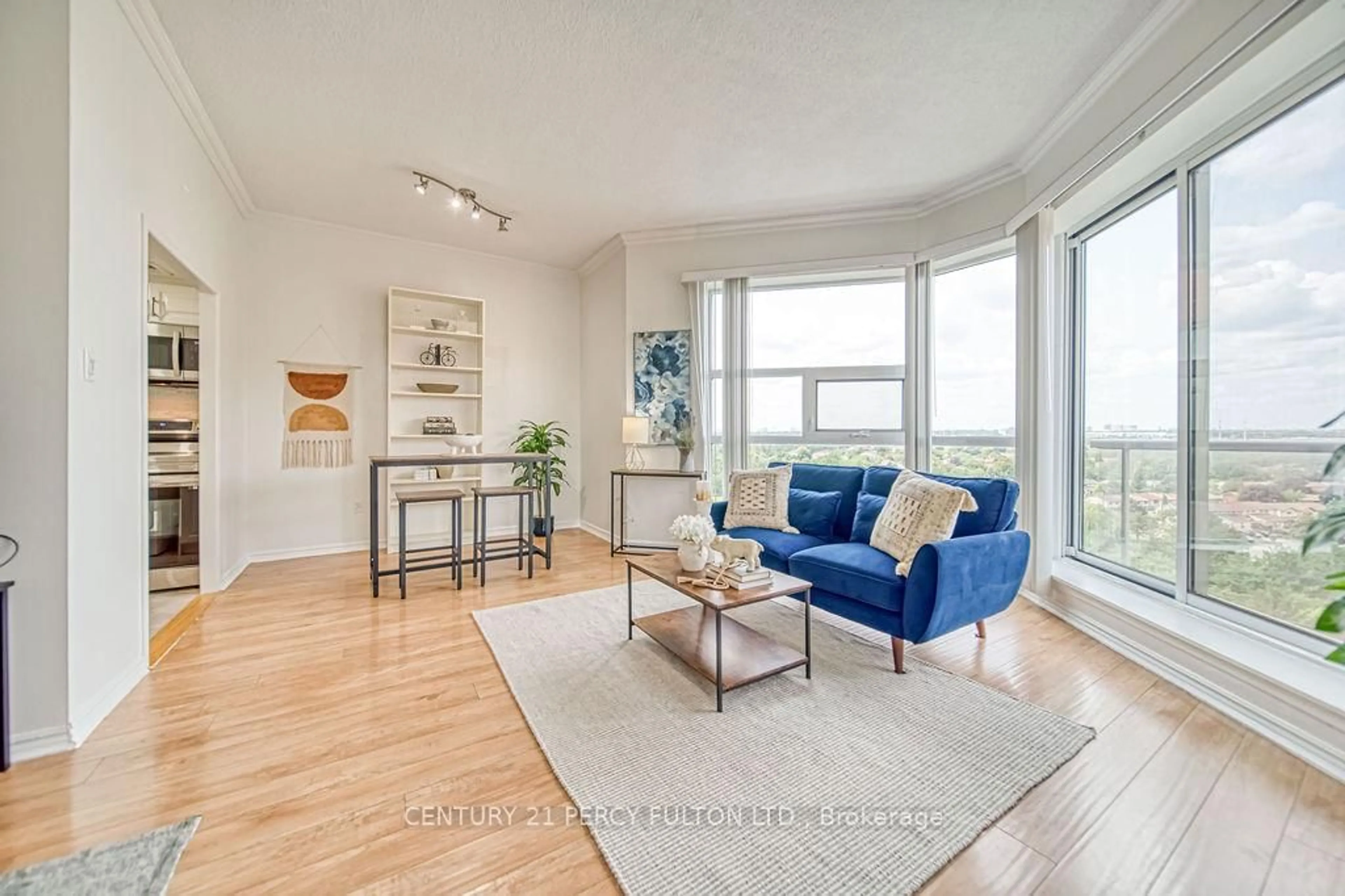 Living room with furniture, wood/laminate floor for 20 Dean Park Rd #1215, Toronto Ontario M1B 3G9