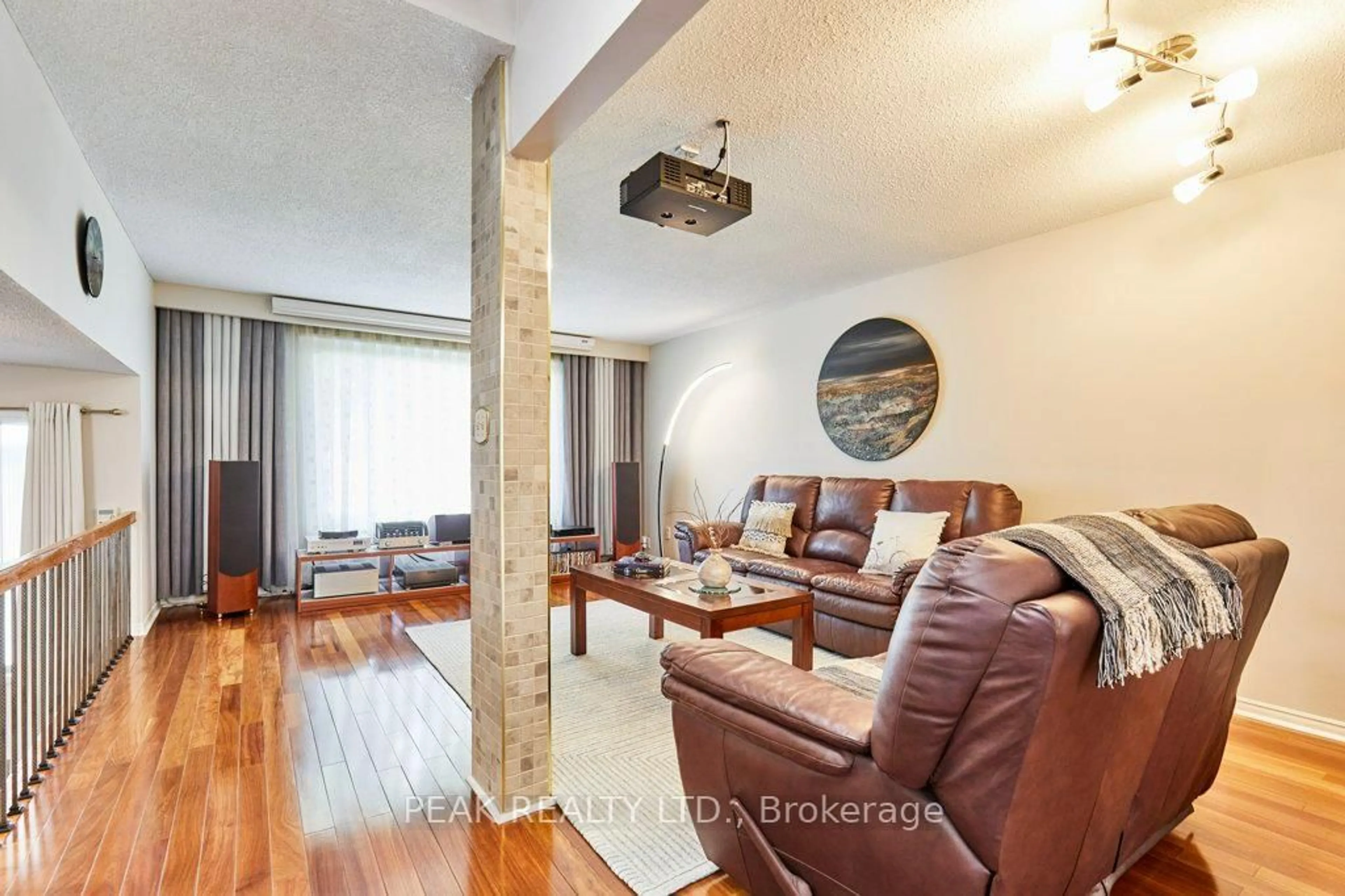 Living room with furniture, wood/laminate floor for 14 Mansfield Cres, Whitby Ontario L1N 6T4