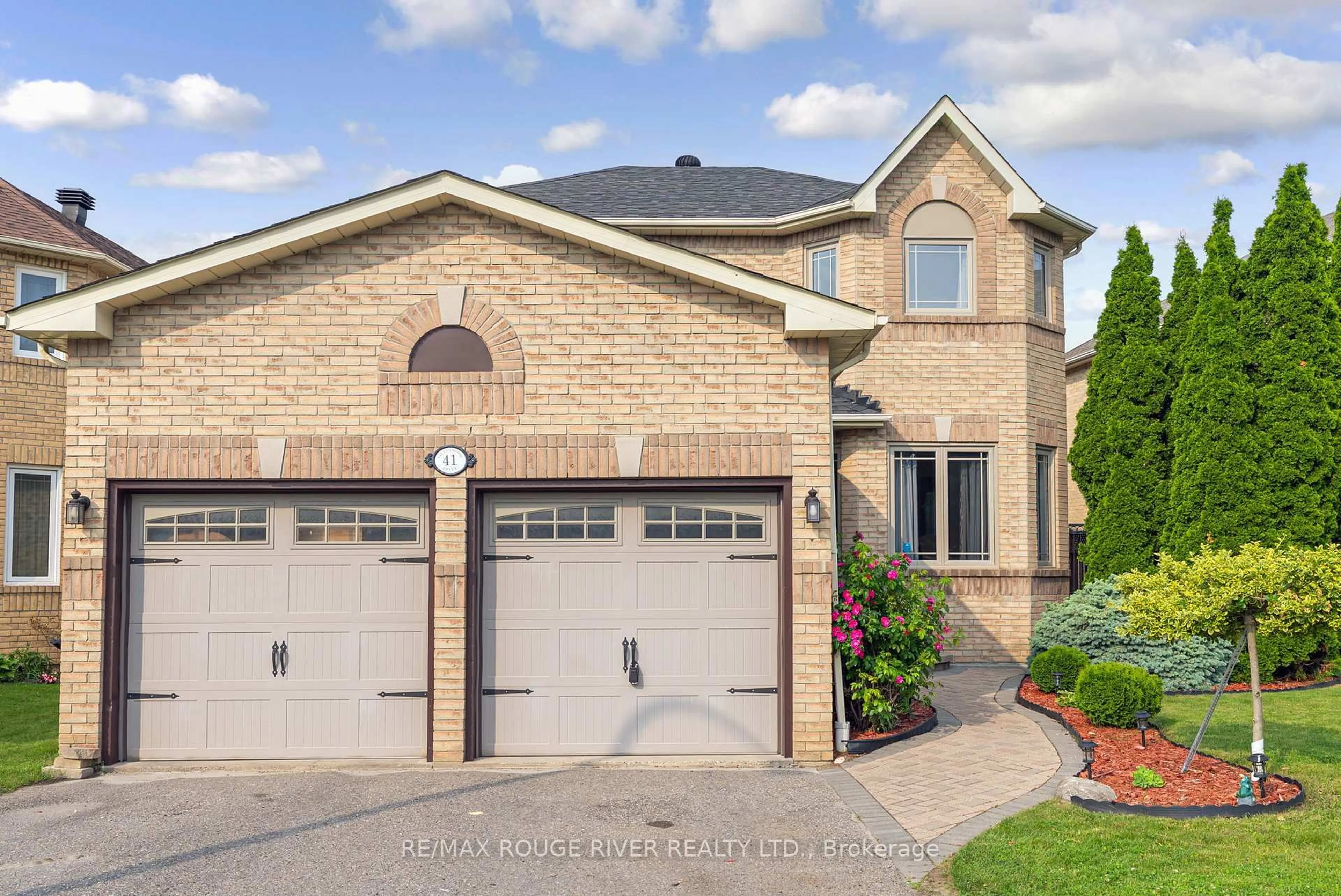 Home with brick exterior material, street for 41 Valleywood Dr, Whitby Ontario L1R 2J5