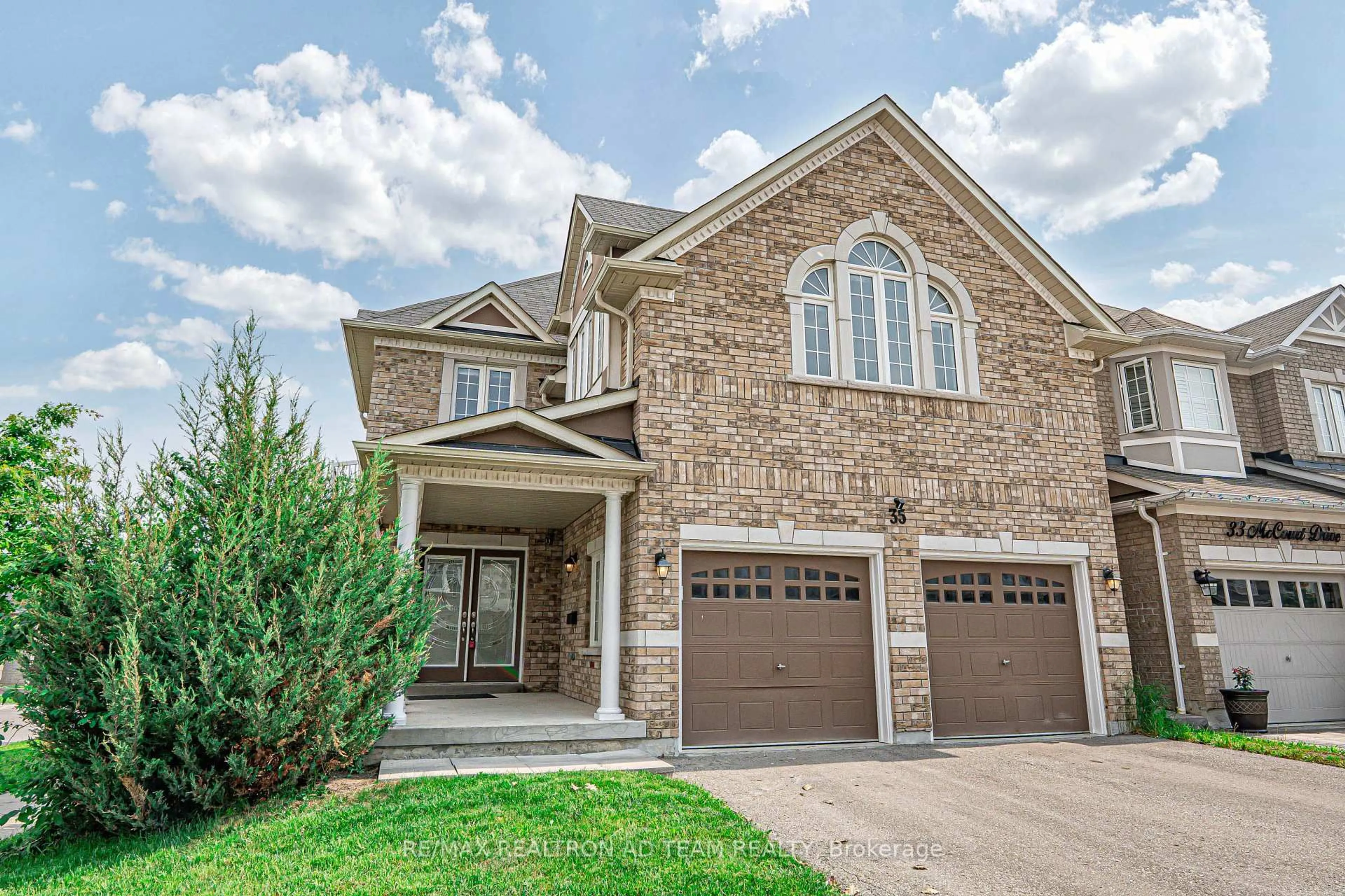 Home with brick exterior material, street for 35 Mccourt Dr, Ajax Ontario L1Z 0P1
