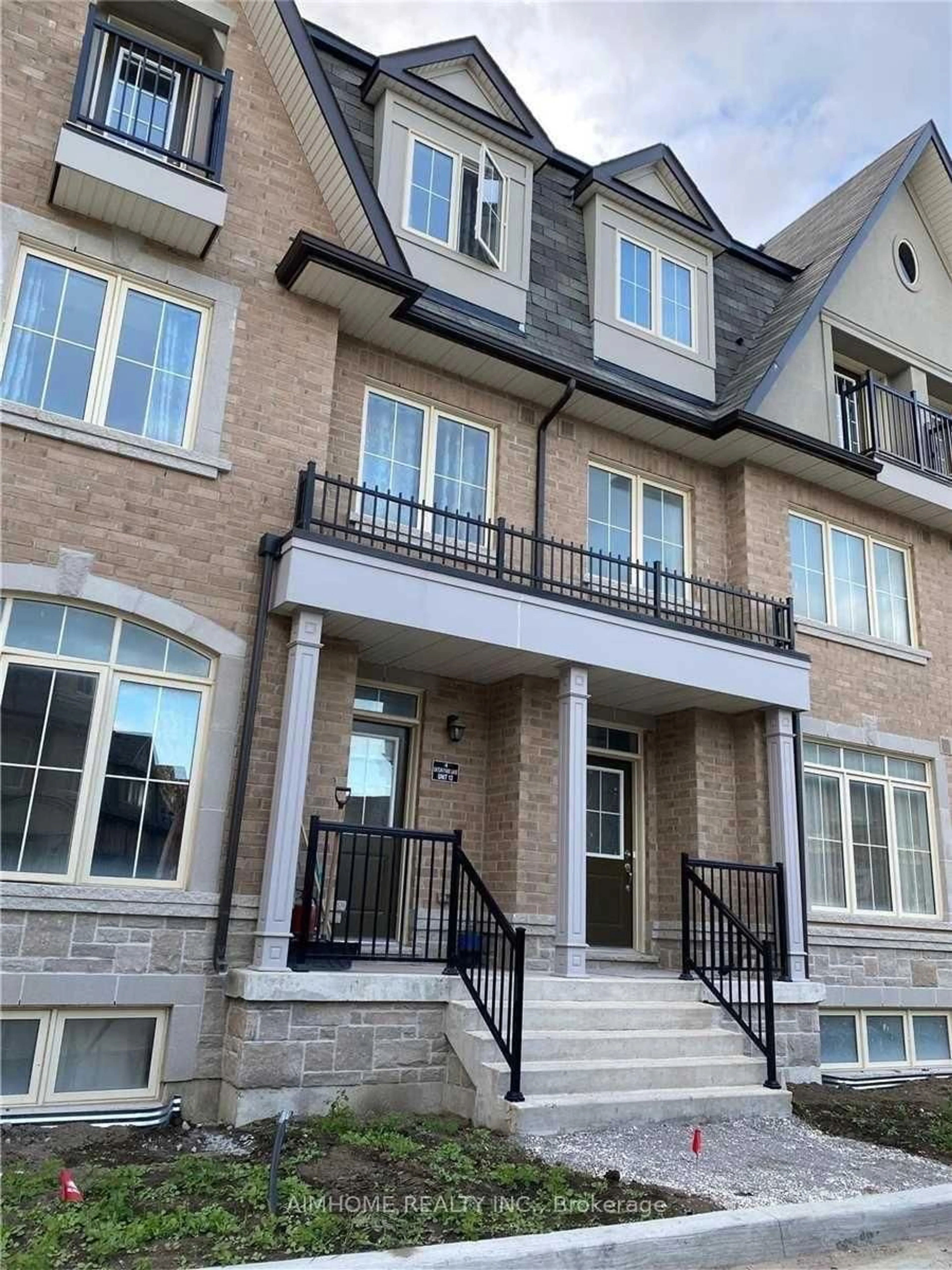 Home with brick exterior material, street for 4 Eaton Park Lane #9, Toronto Ontario M1W 0A5