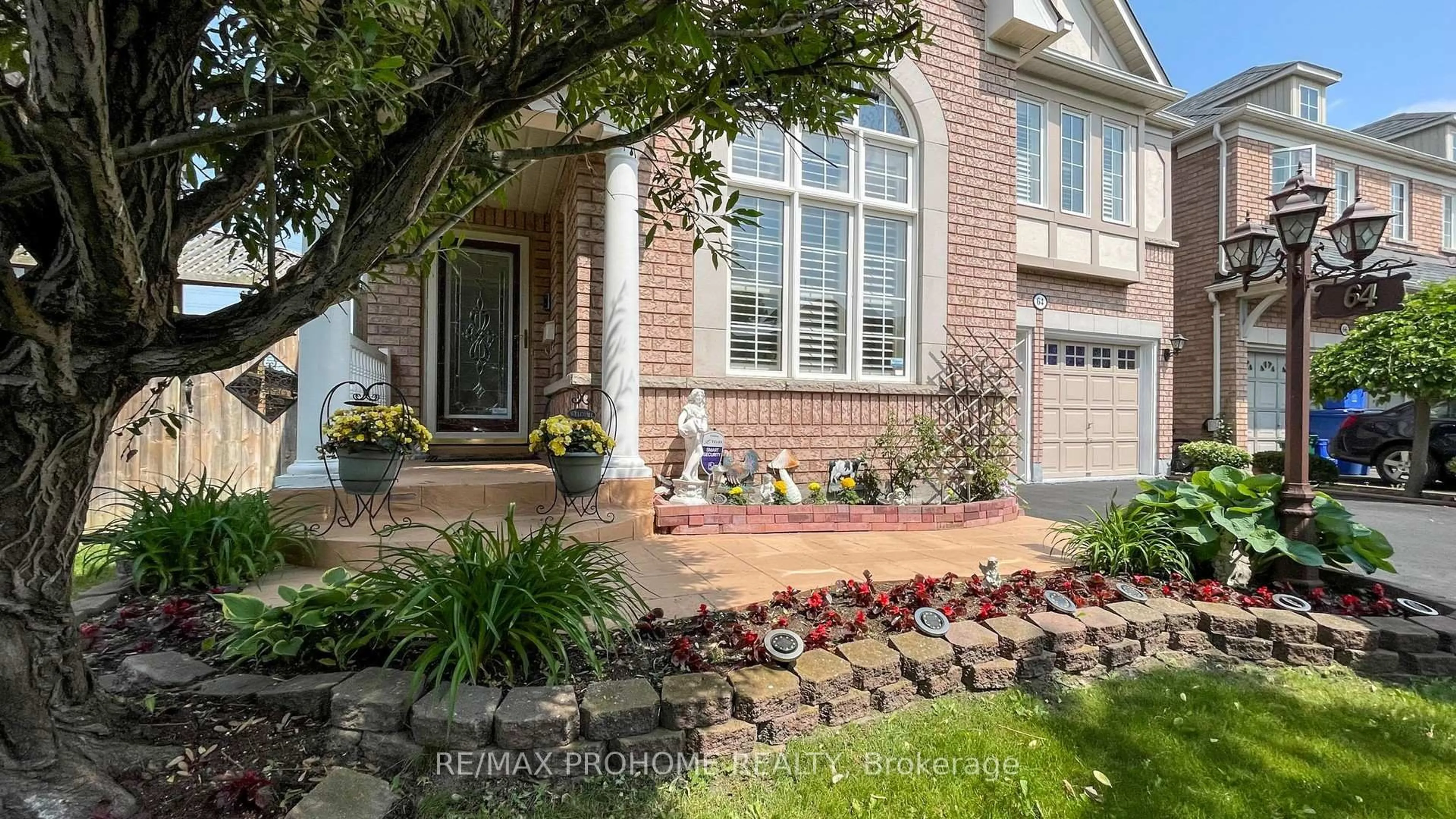 Home with brick exterior material, street for 64 Grainger Cres, Ajax Ontario L1T 4Y6